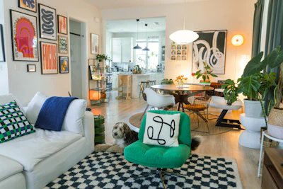 Cozy living room with eclectic art and a dog