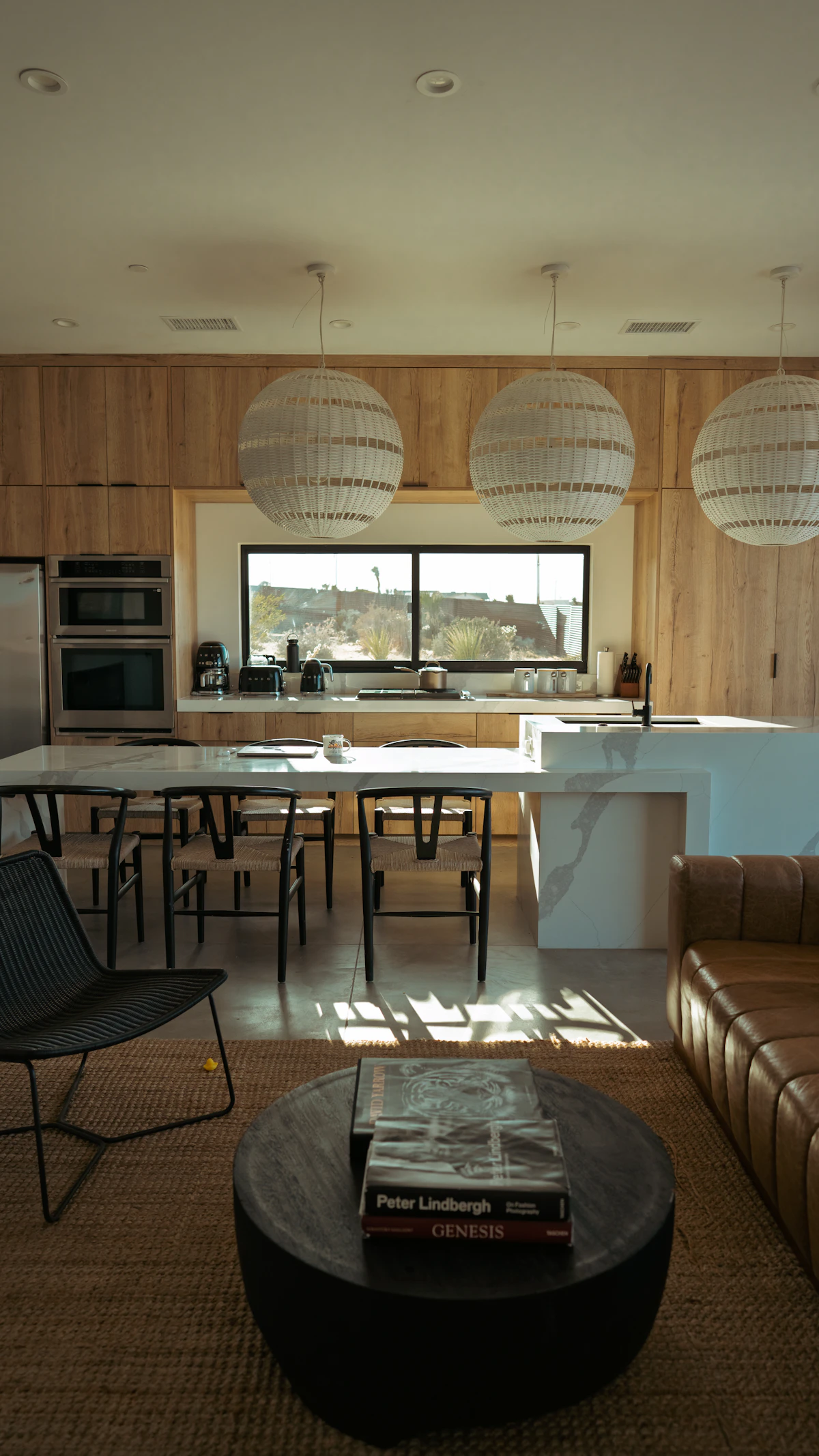Modern sunlit kitchen and living space with clean contemporary design