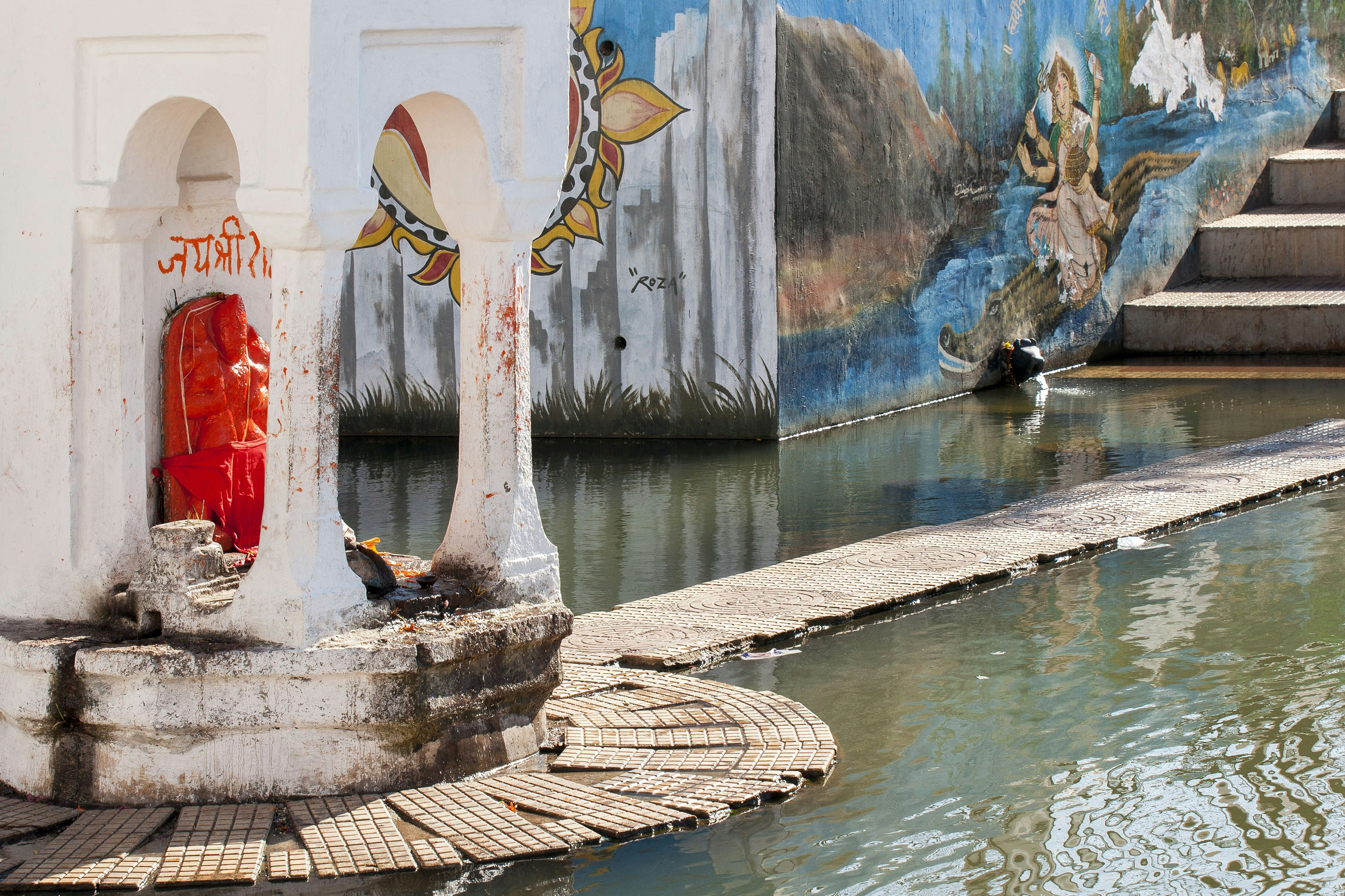 A religious site next to water.