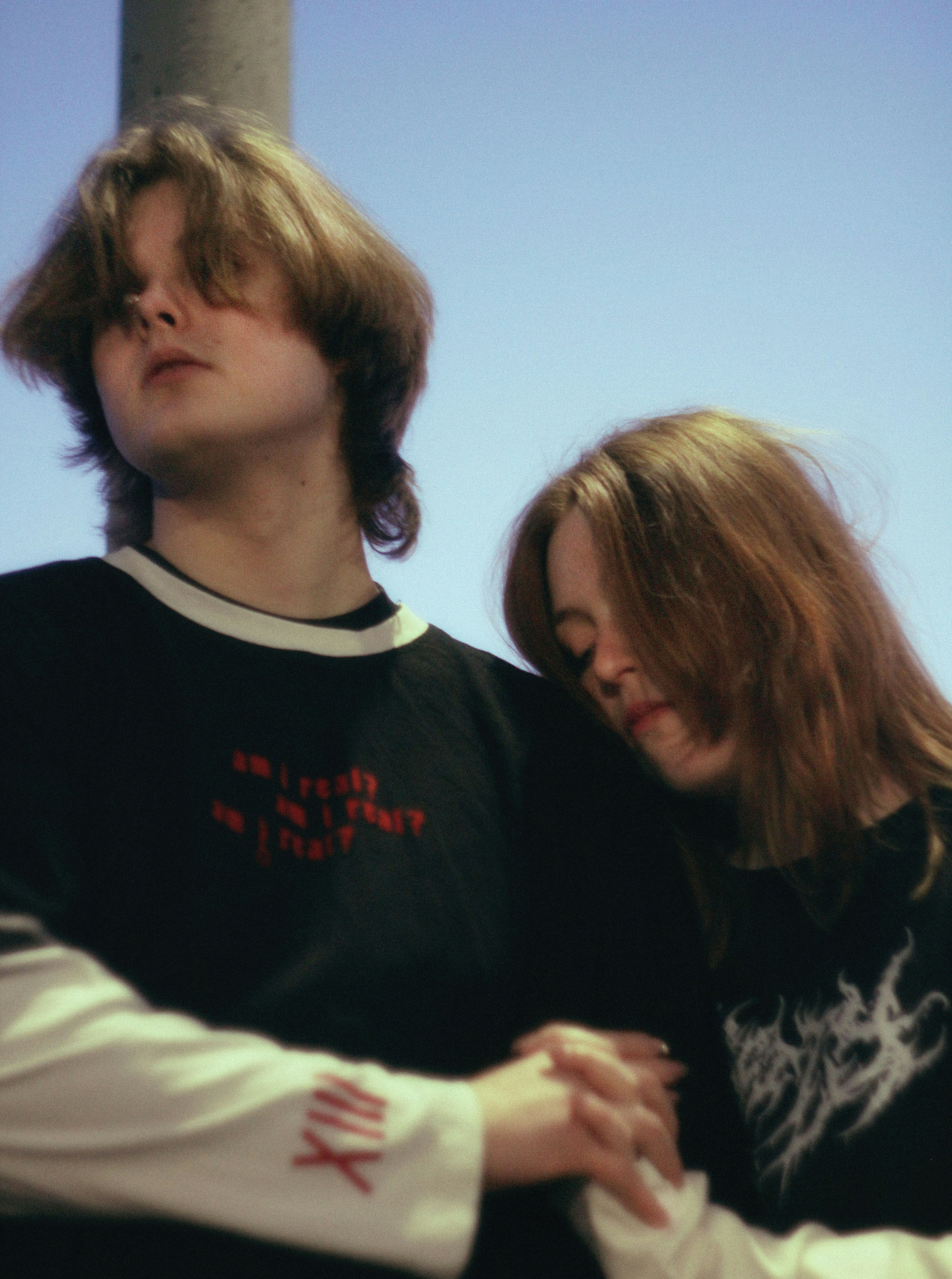 Two young people pose for a photograph together.