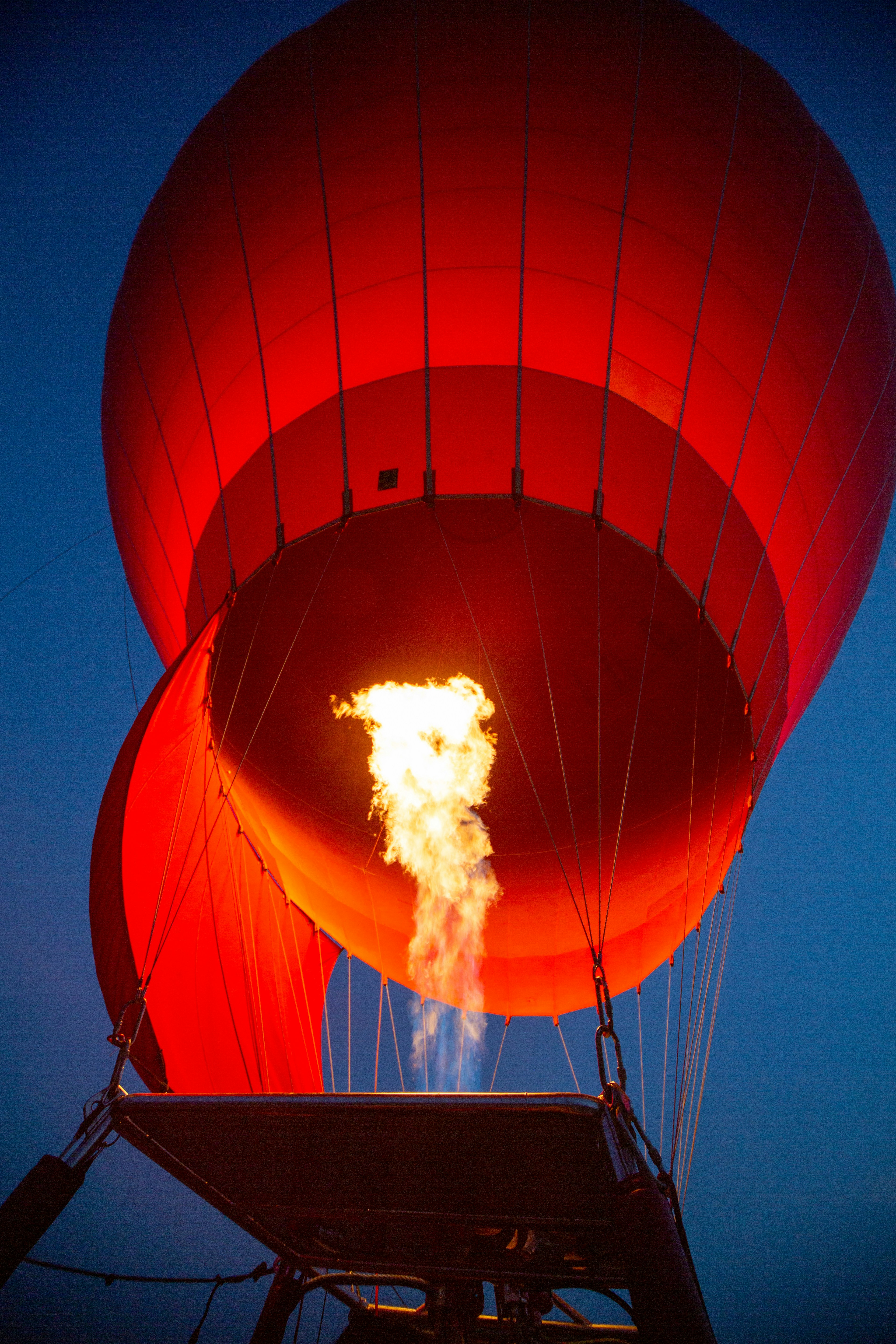 A hot air balloon inflates with fire.