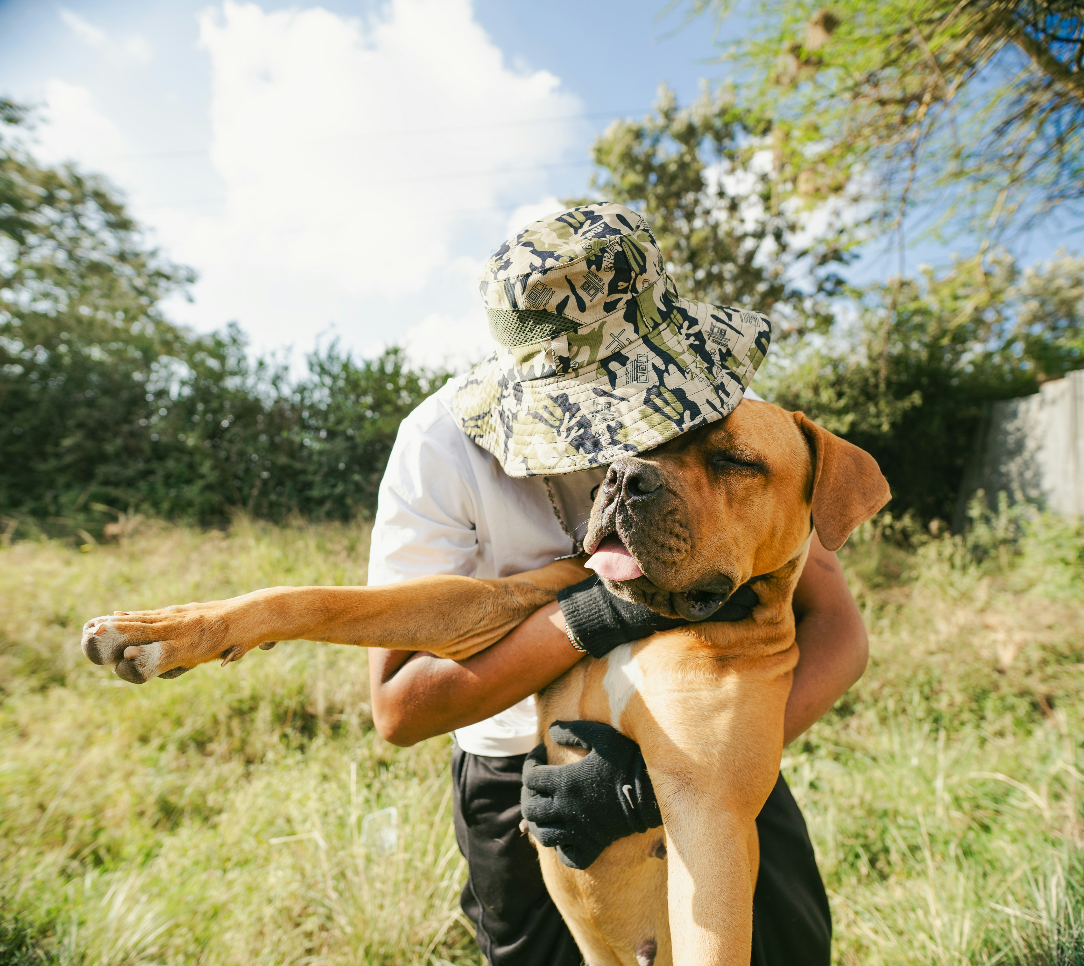 Man hugging large dog