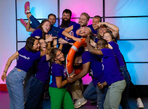 Group of people happily posing for a photo.