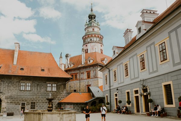 Old european architecture with a central tower is displayed — Český Krumlov, Czech Republic