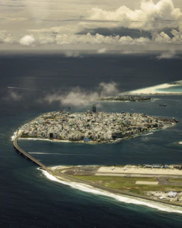 Aerial view of a city surrounded by ocean.