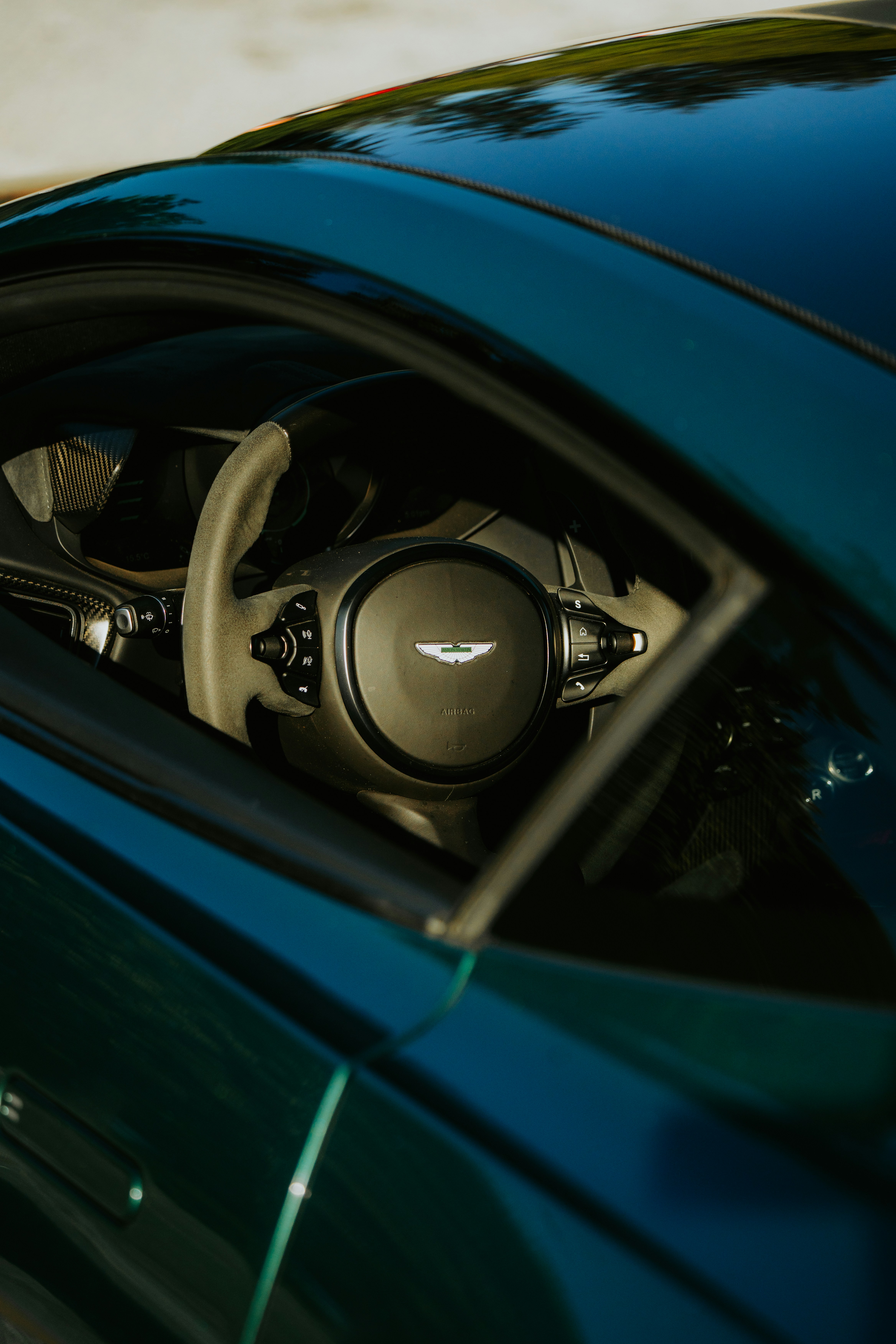 Premium vehicle interior with a refined steering wheel and detailed cabin materials