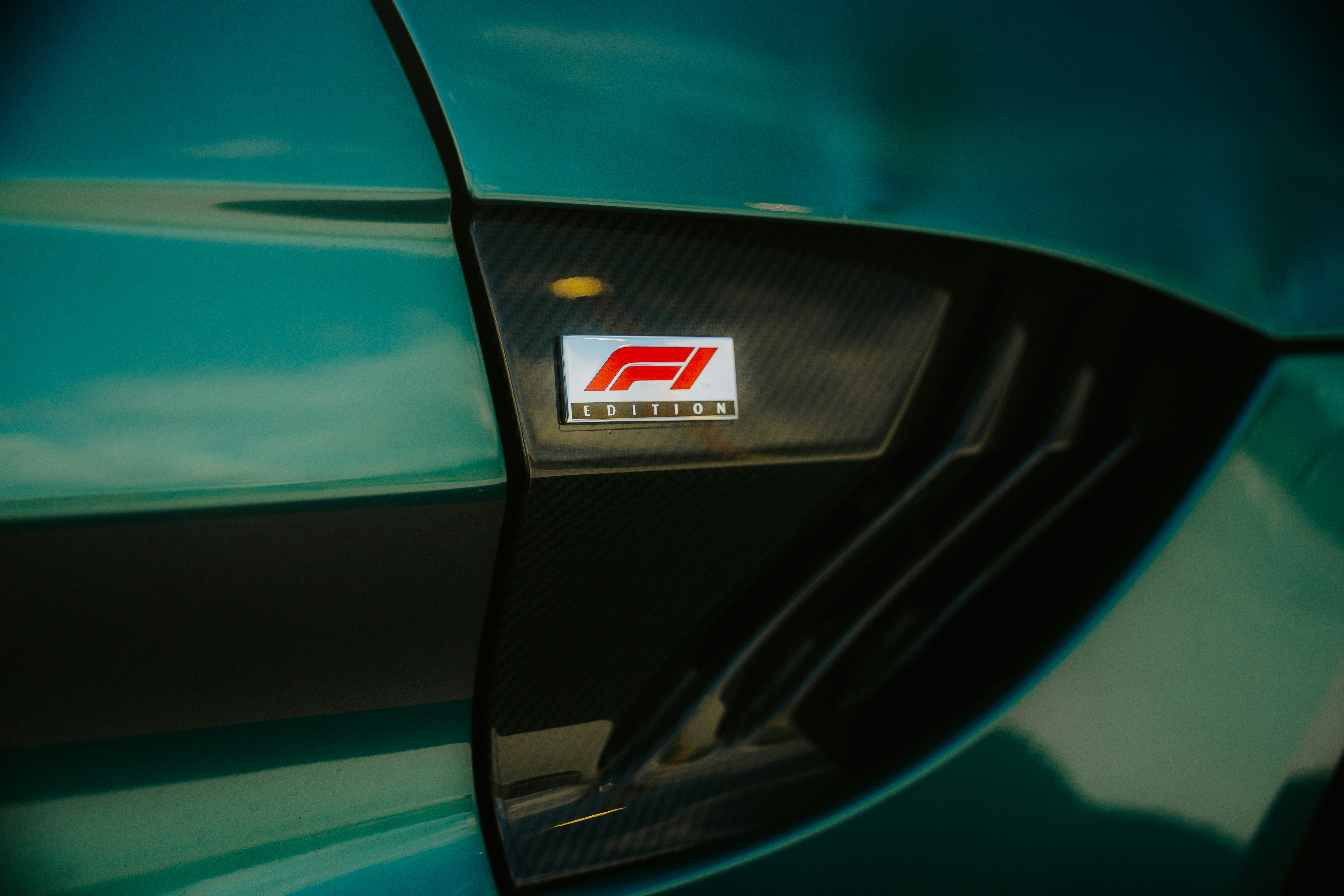 An f1 car emblem is visible on the car.