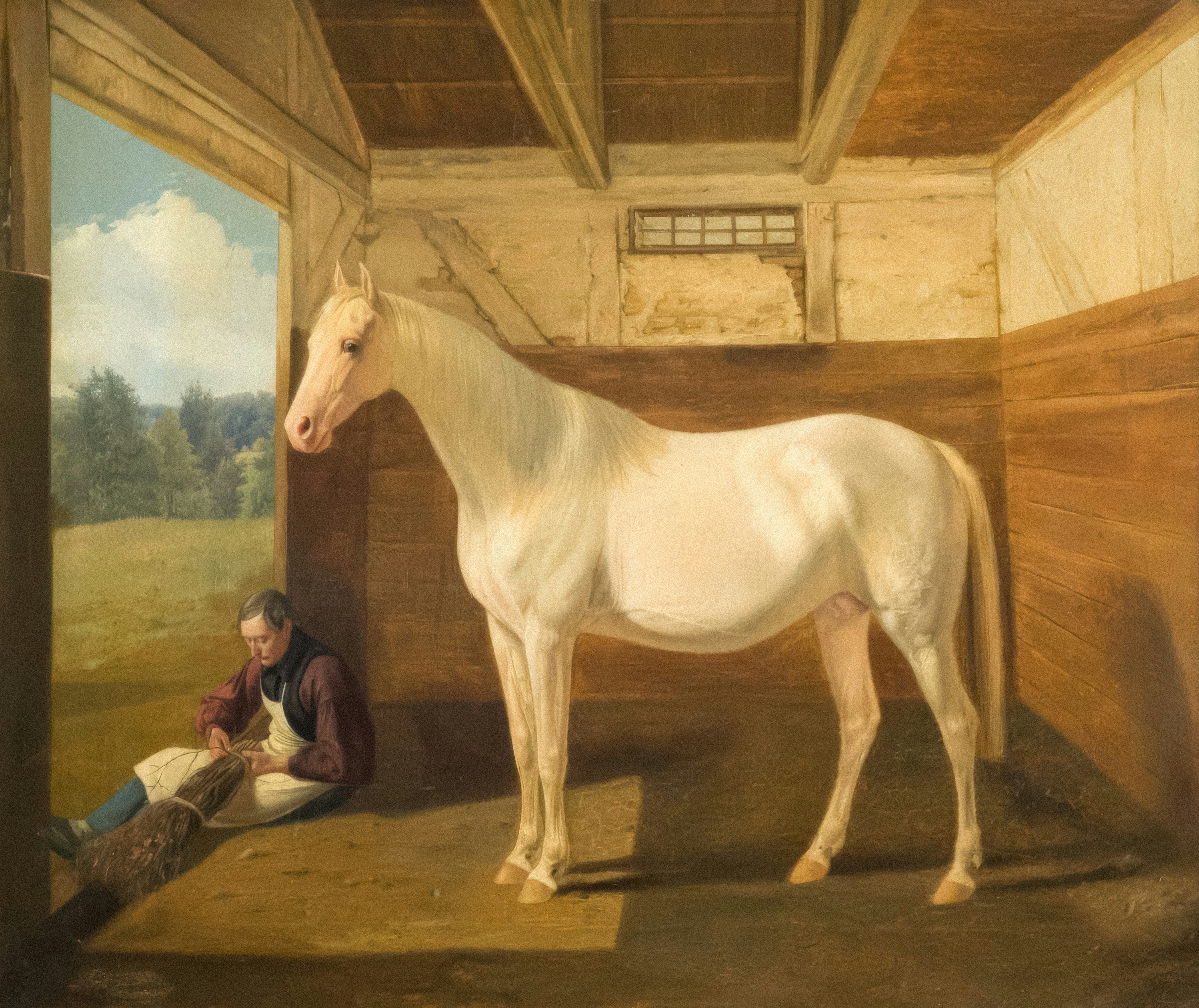 A white horse stands in a stable with a man photo – Free Art Image on ...