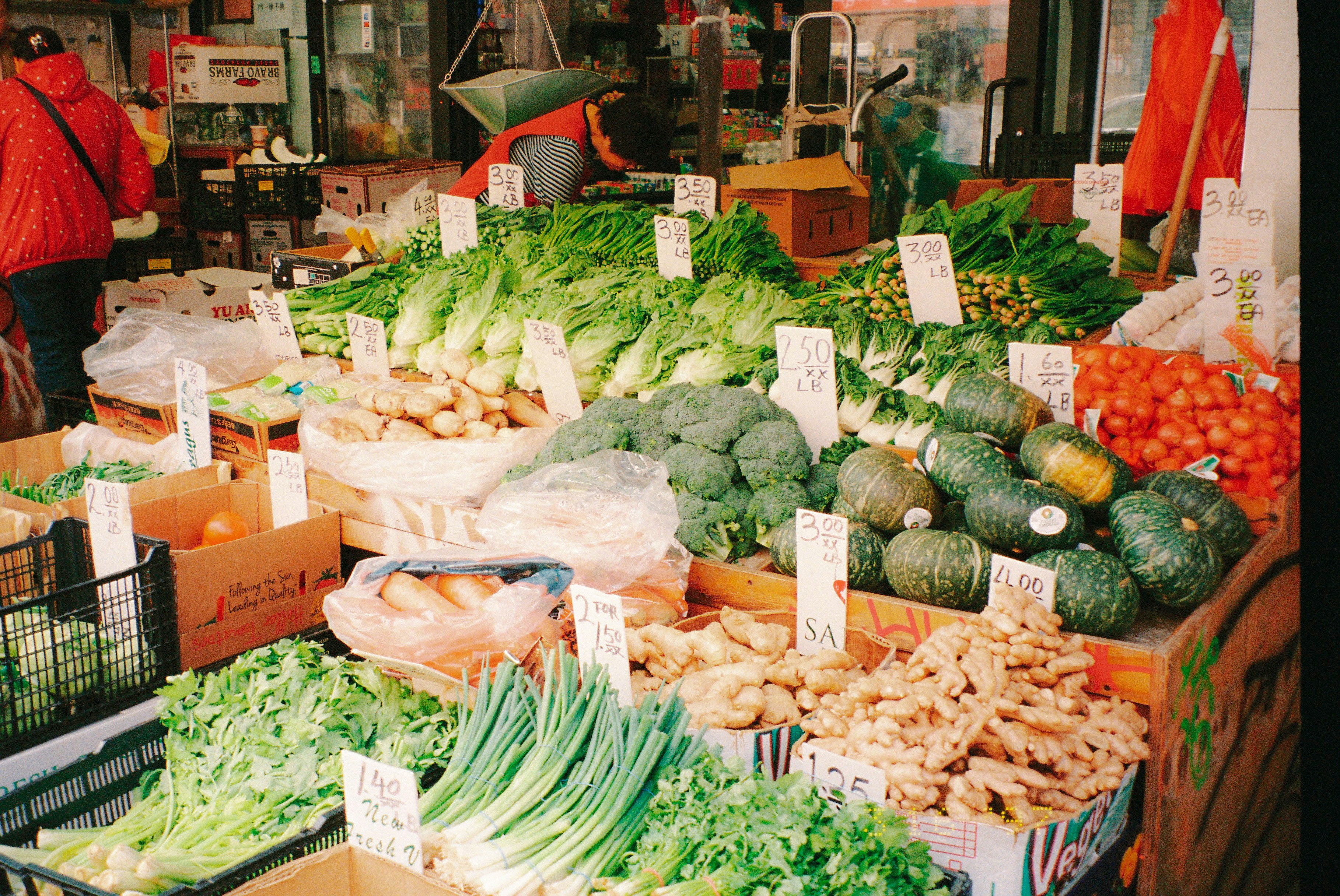 Fresh vegetables are displayed at a vibrant market.