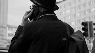 A man talks on the phone in the city.