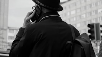 A man talks on the phone in the city.