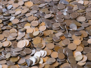 A large pile of various coins.