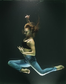 Woman poses gracefully while underwater.