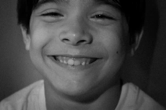 A happy young boy with a big smile.