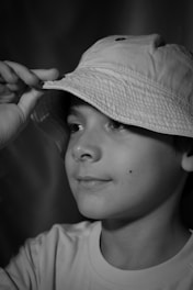 Boy wearing a bucket hat 