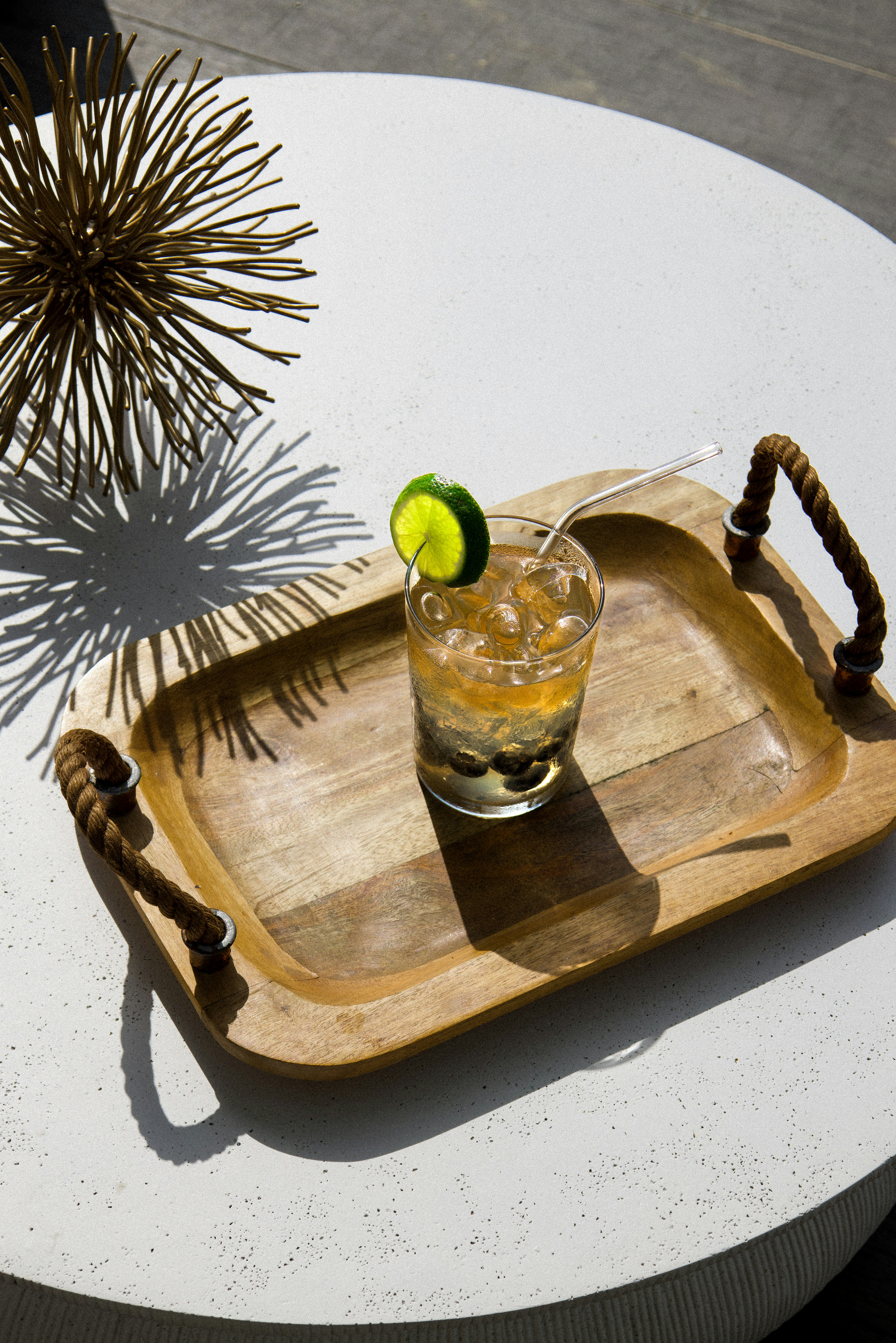 Cocktail on a tray, ready to be enjoyed.