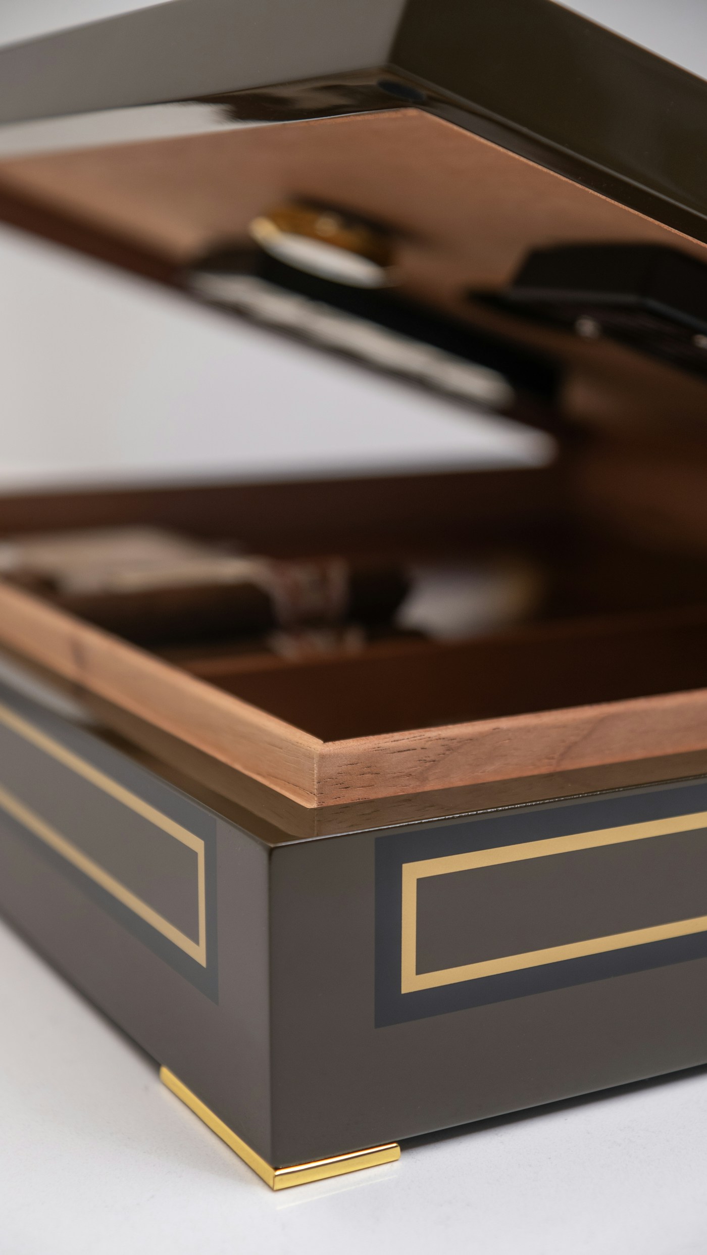 Daniel Marshall burl walnut humidor — open on a desk