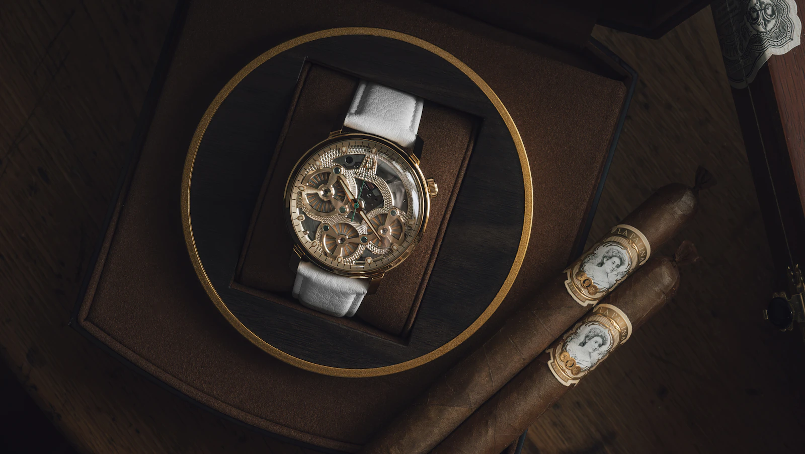 Classic watch and cigars arranged on a refined table