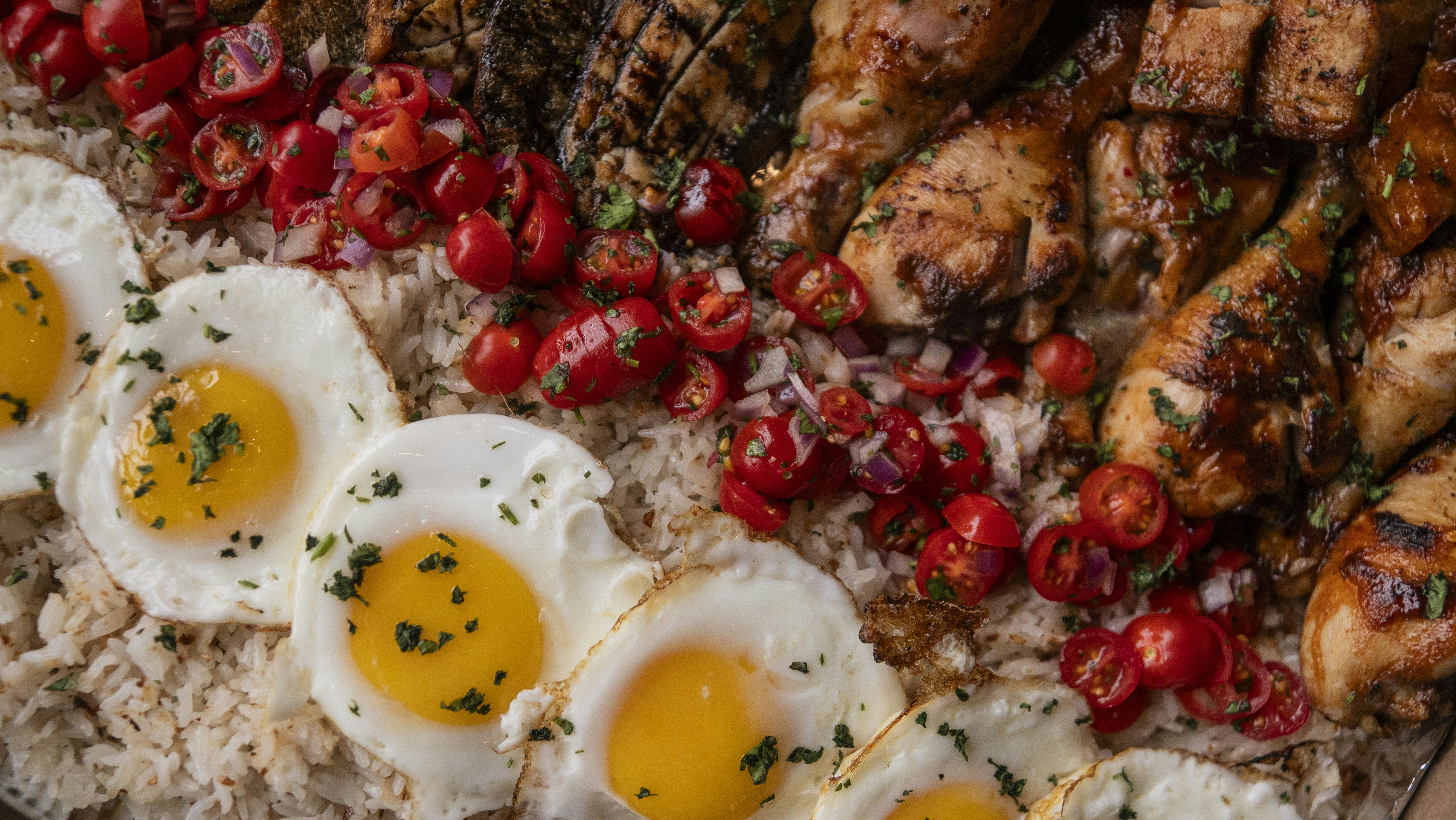 Chicken, eggs, and rice: a delicious food platter.