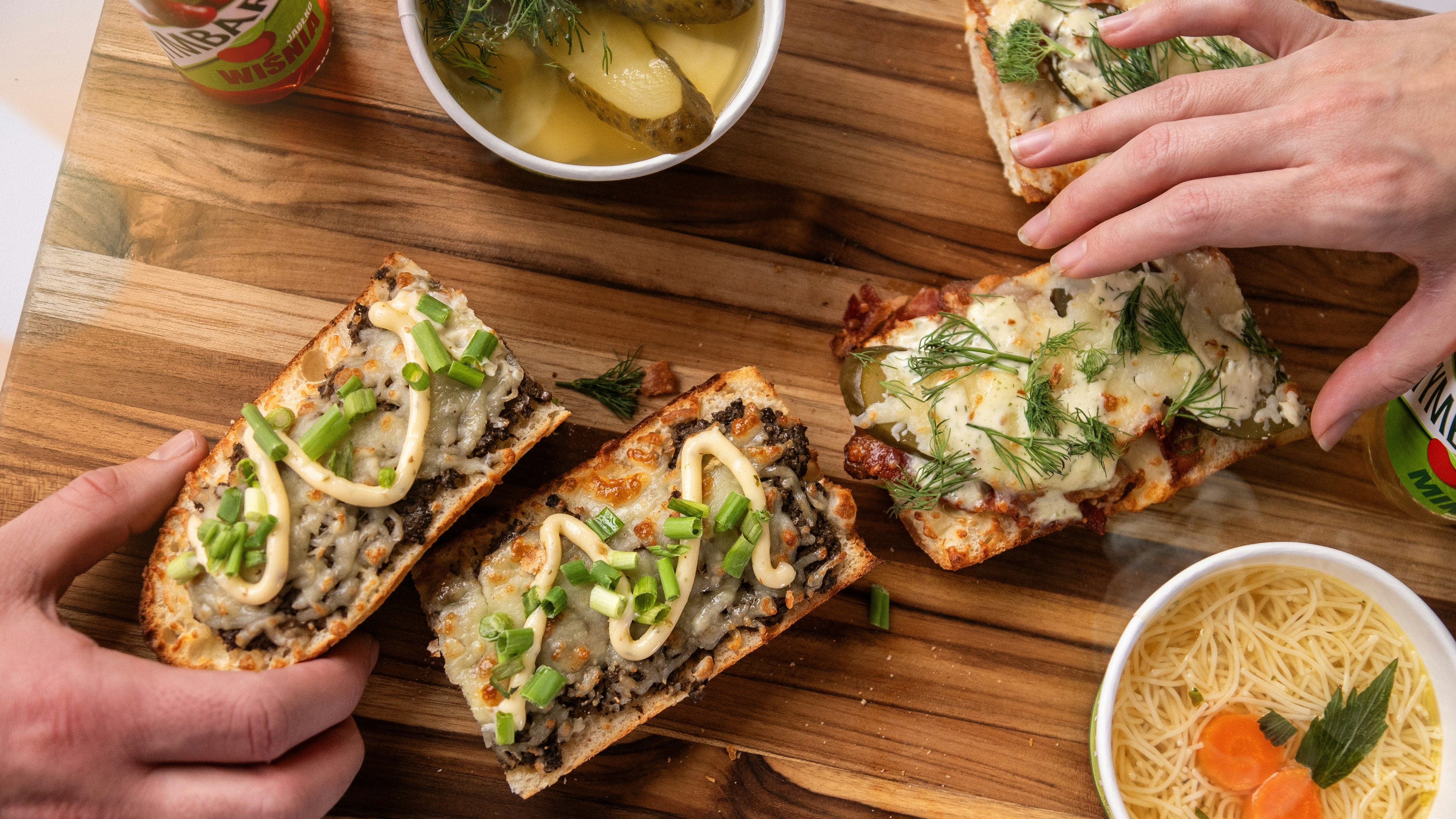 Delicious food on a wooden board being enjoyed.