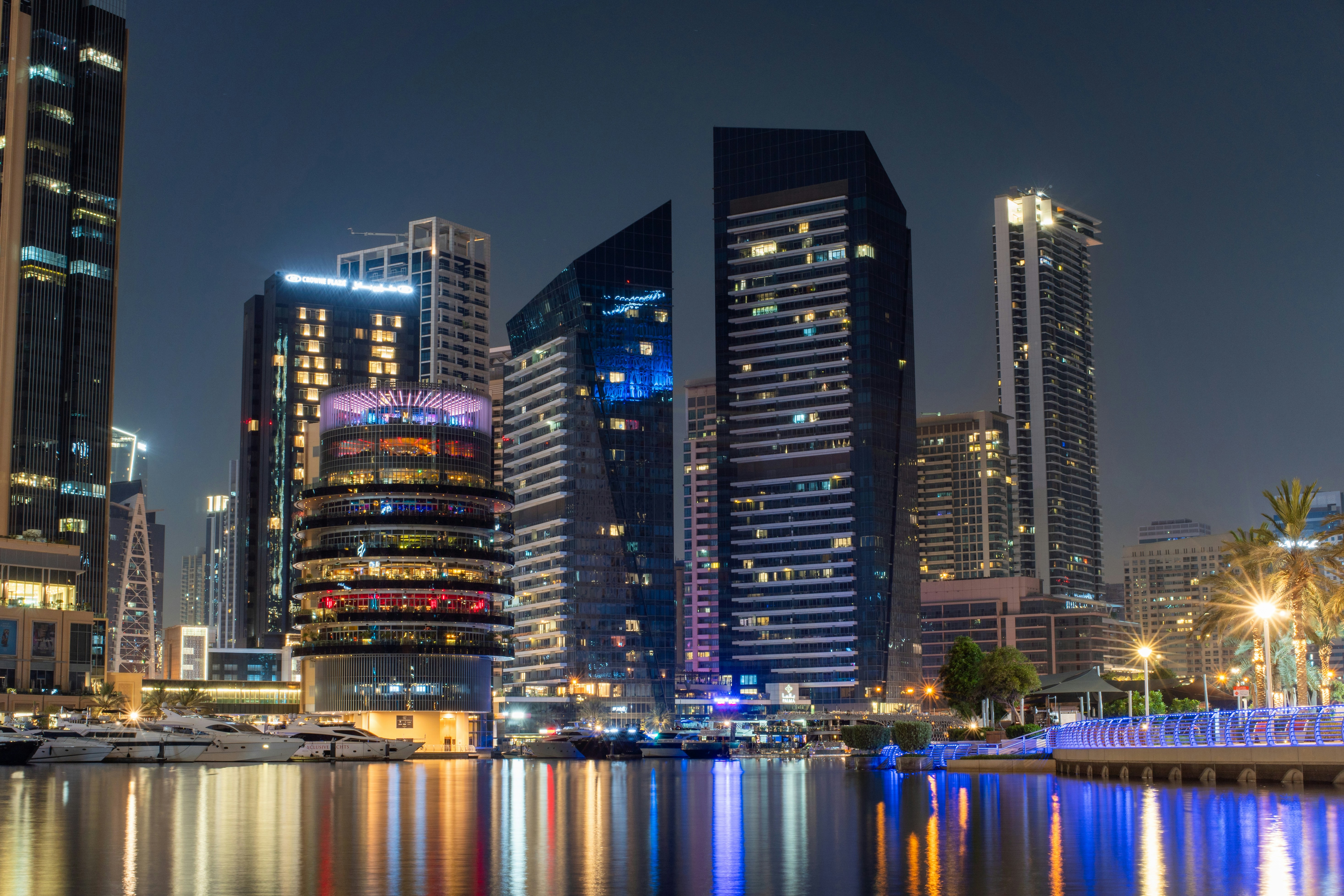 Dubai's illuminated skyline sparkles at night.