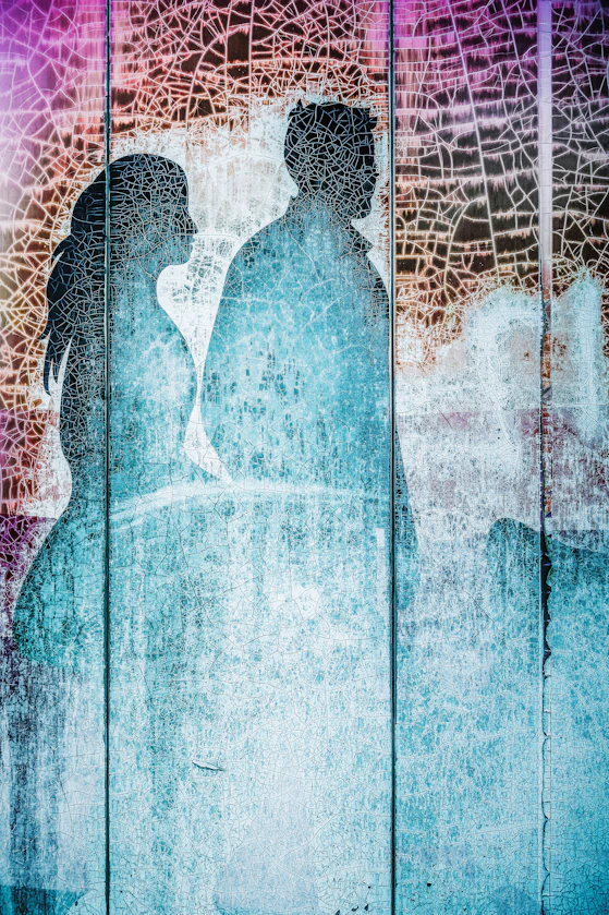 A couple silhouetted with interesting textures.