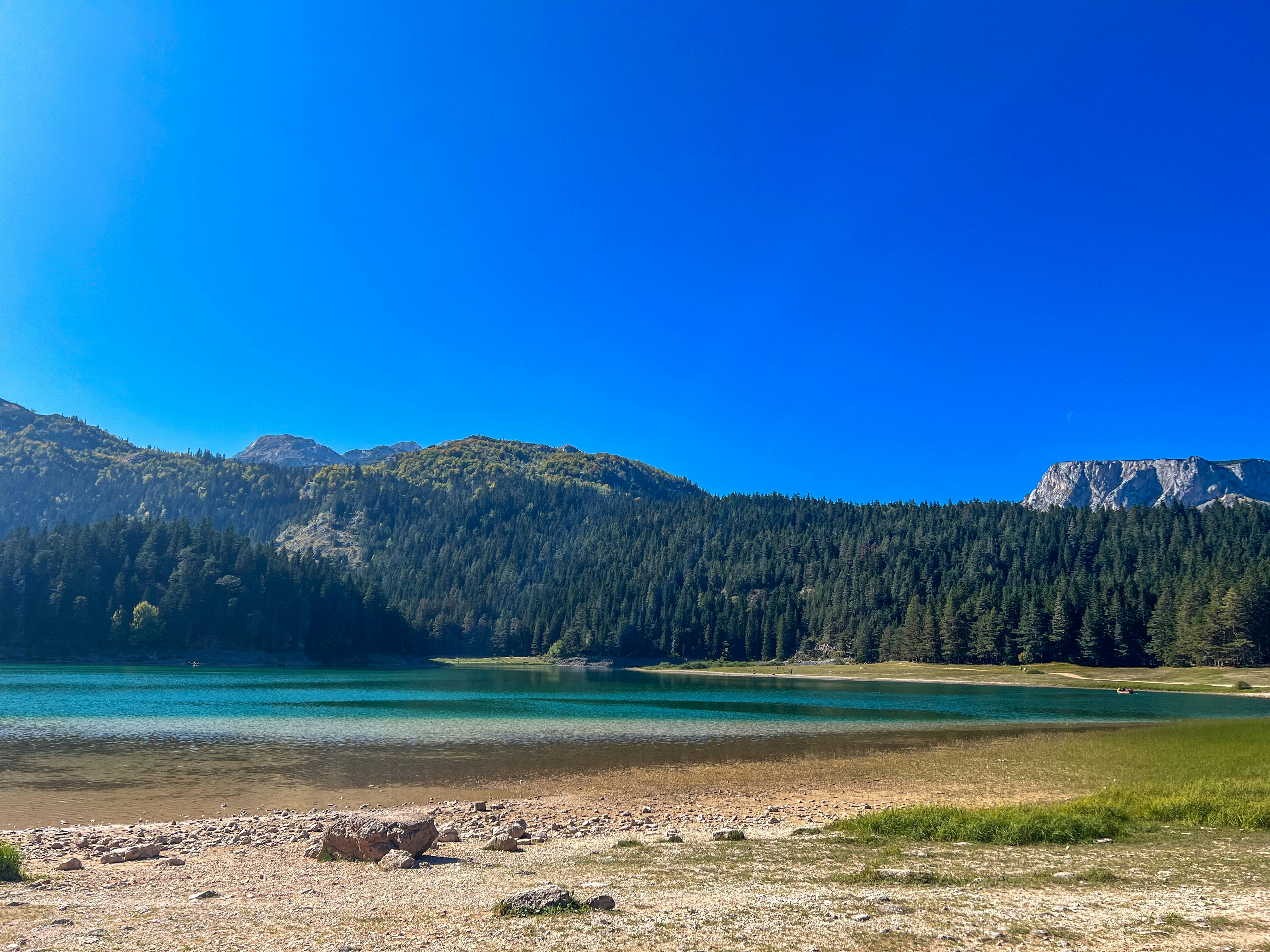 Beautiful lake and mountains under a clear, blue sky.