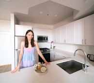 Woman in a modern kitchen with tea.