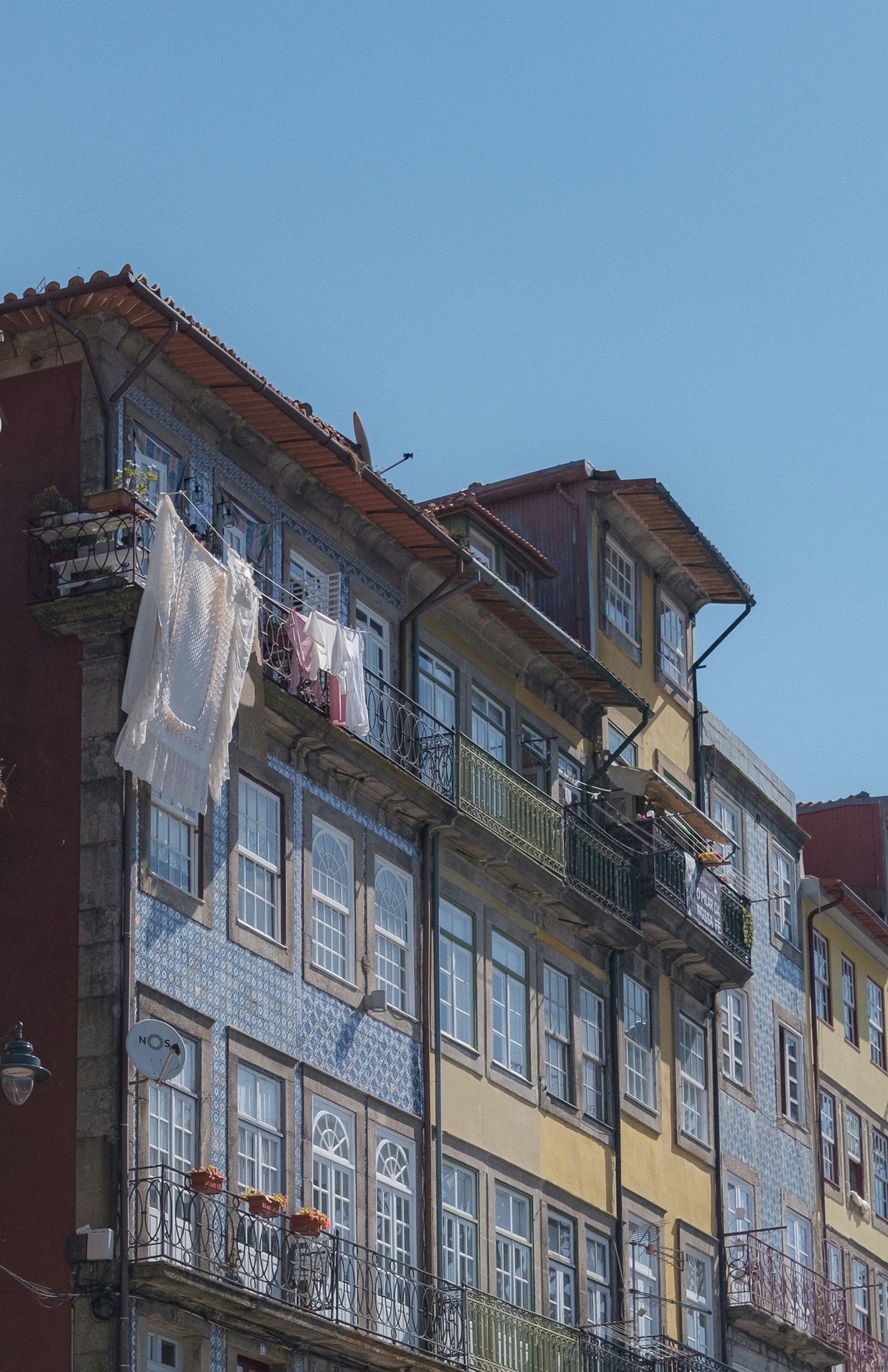 Colorful buildings with laundry drying in the sunshine.
