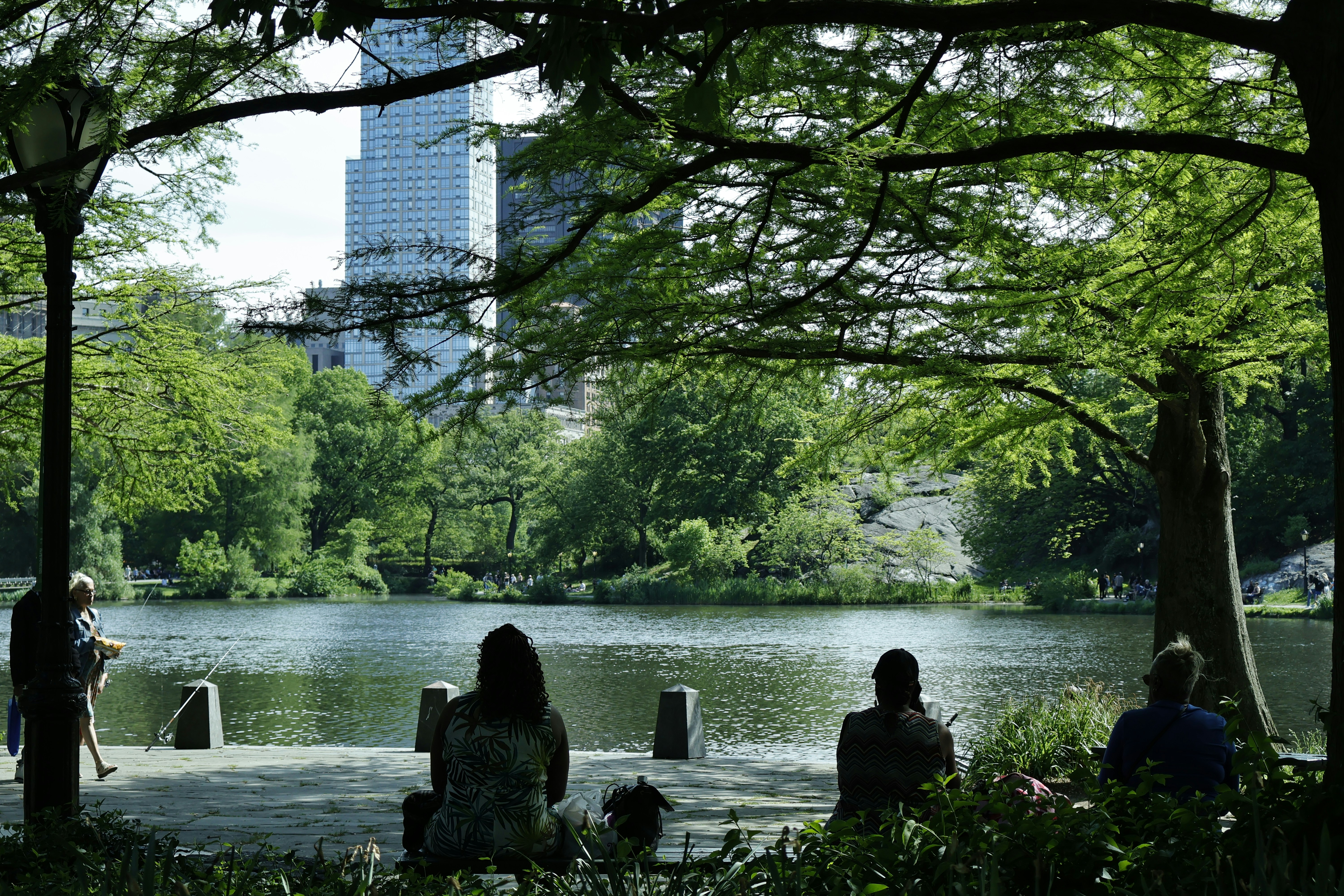 People enjoy a peaceful day by the lake.