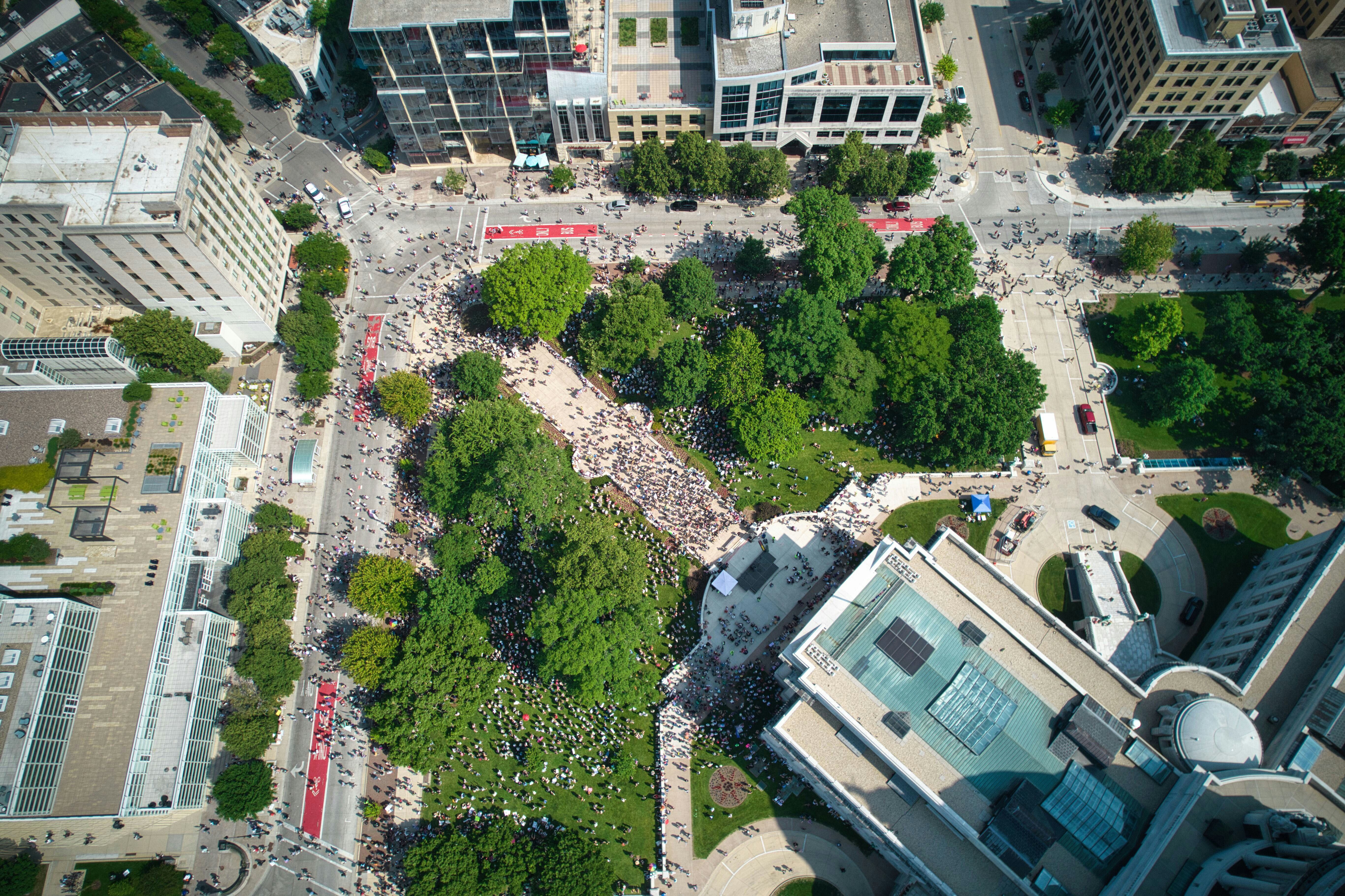 People gather in a city square.