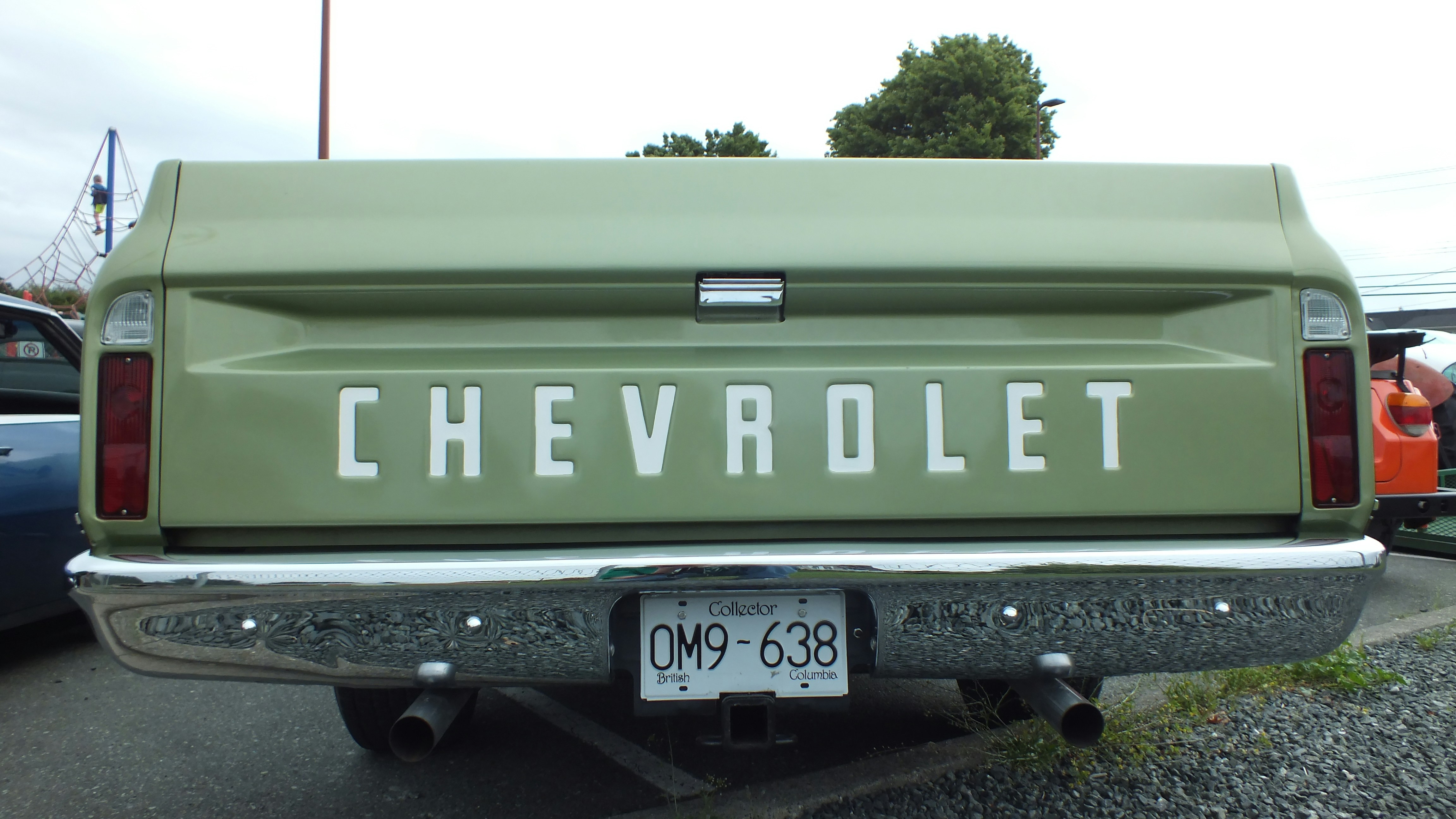 The rear of an old chevrolet truck.