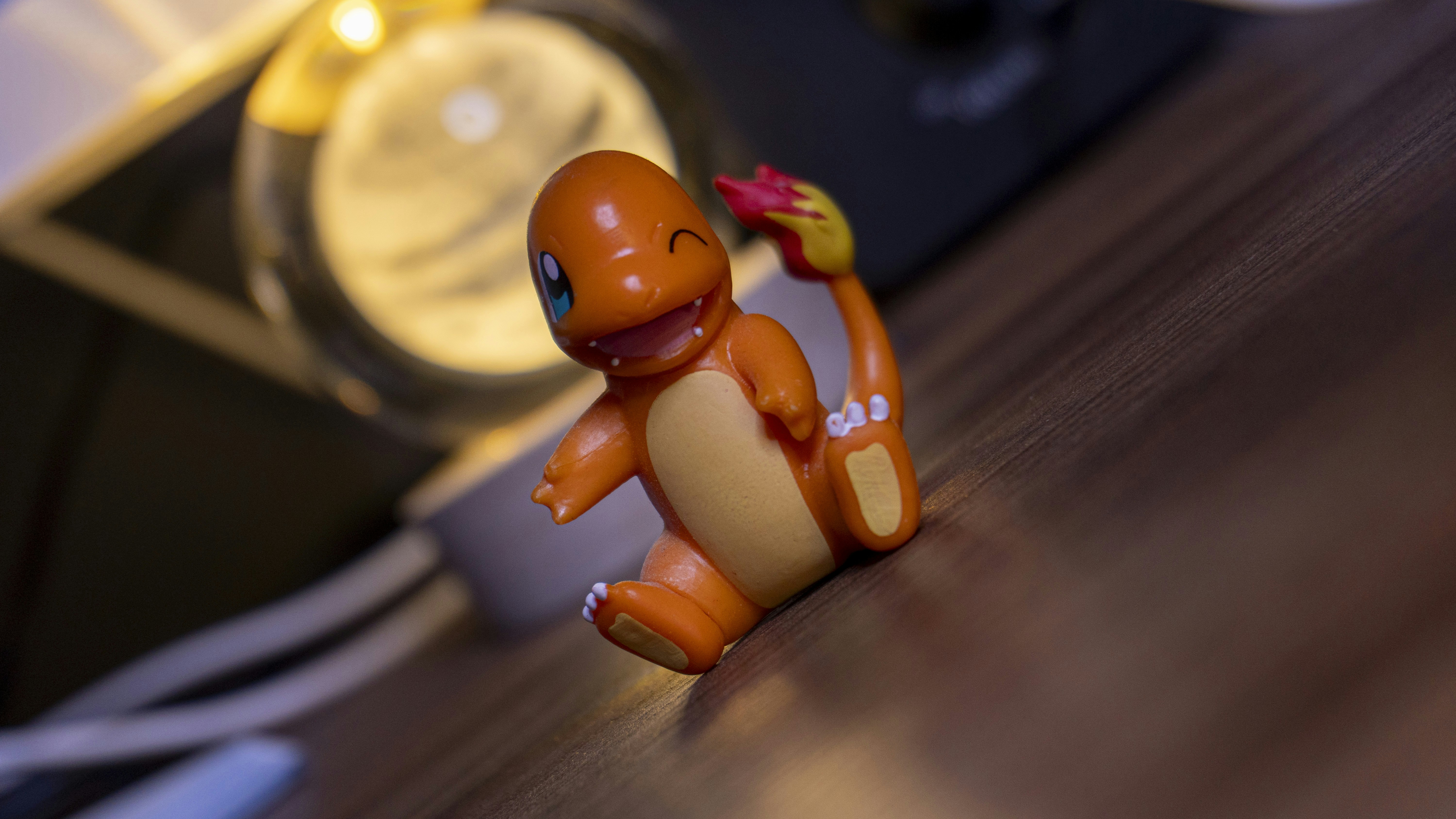 A charmander figure smiles for the camera.