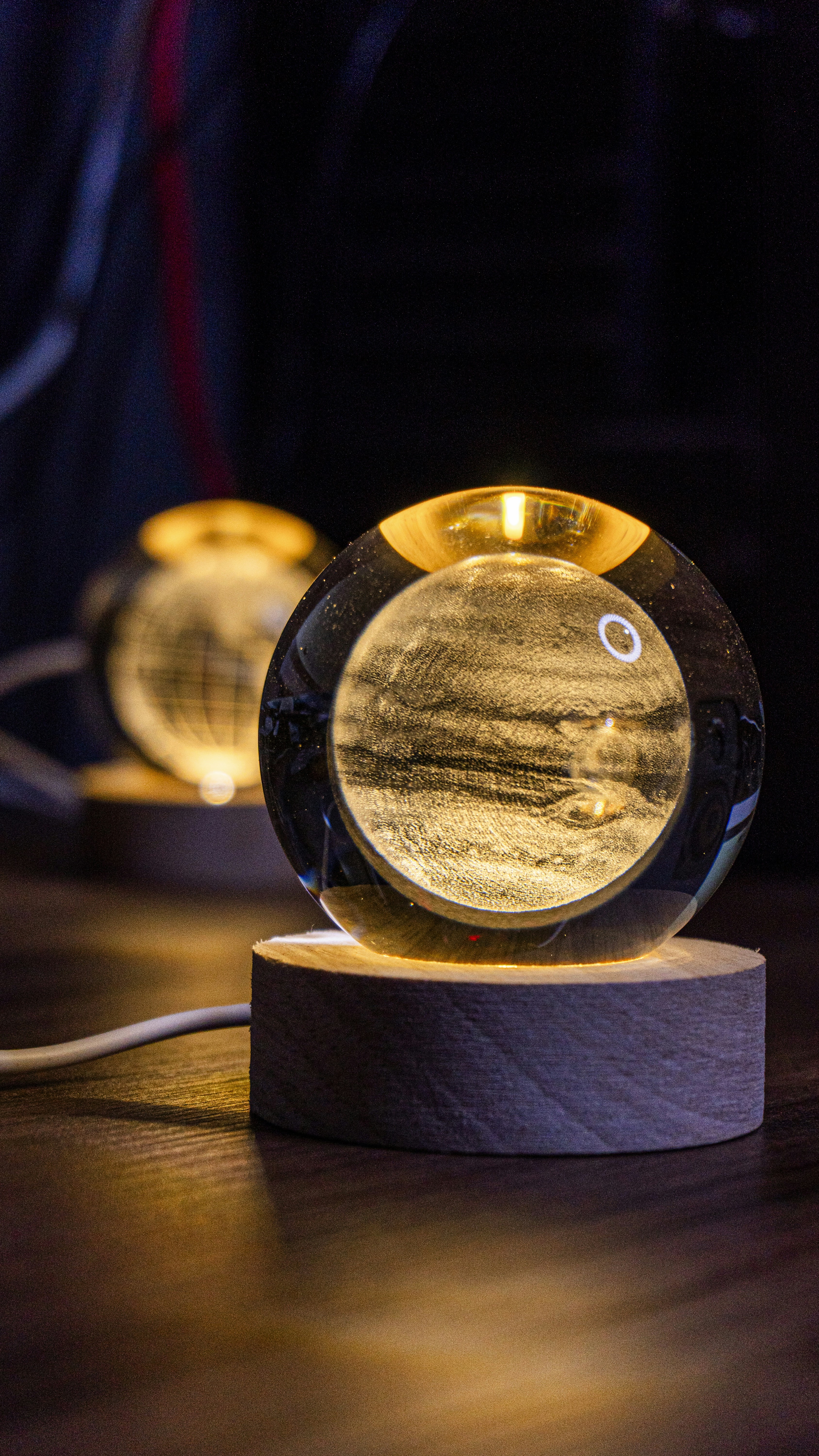 Glowing orbs with landscape detail are illuminated.