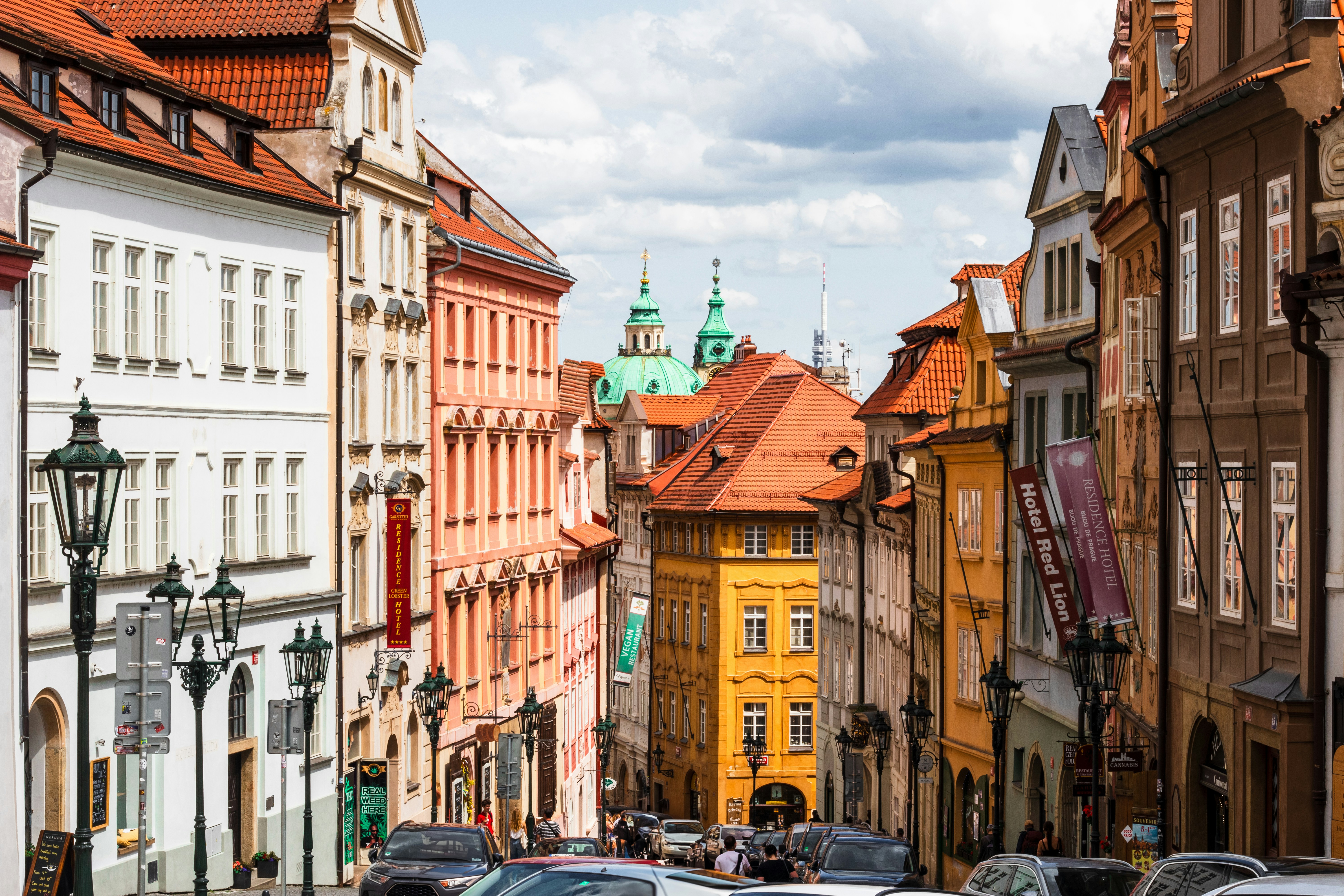 Picturesque european buildings line a cobblestone street.