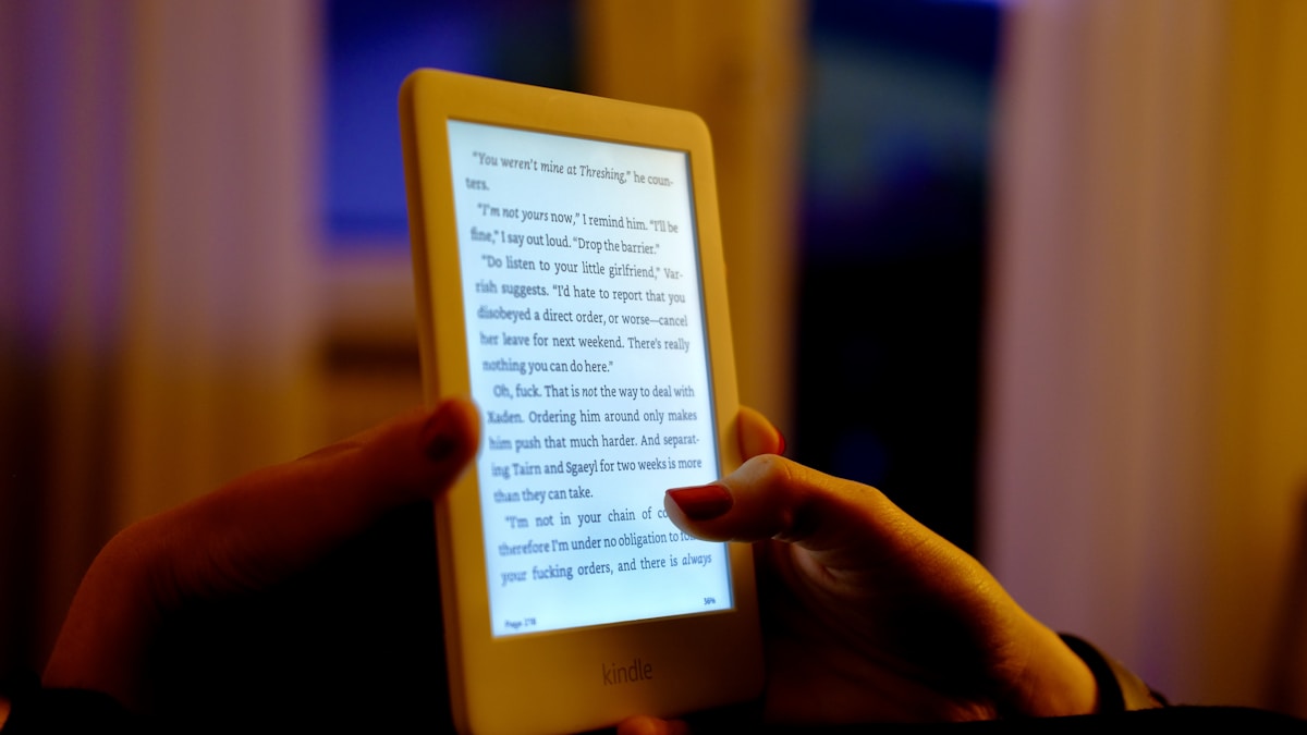A person is reading an e-book on a tablet.