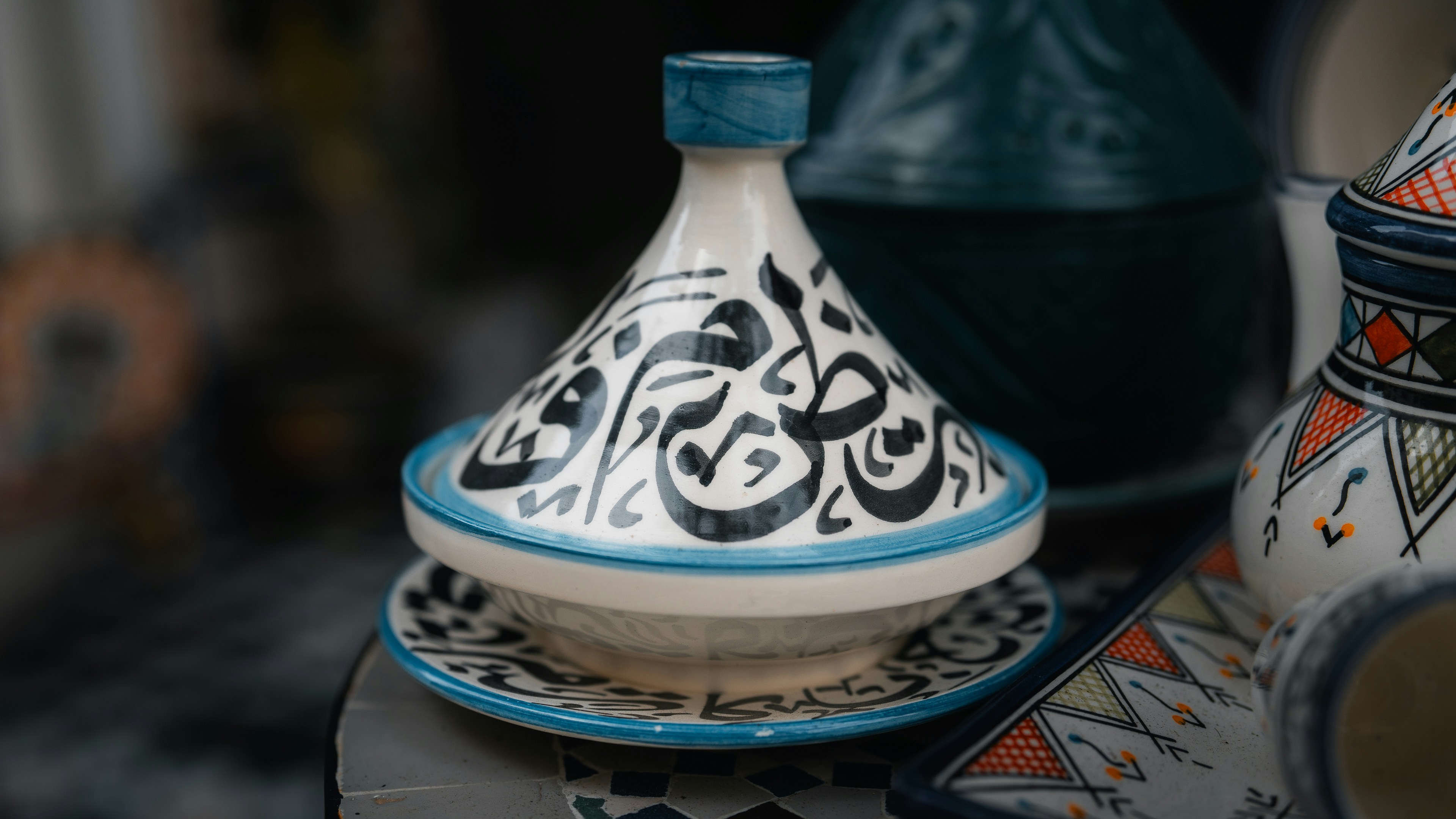 A ceramic tagine with arabic calligraphy.
