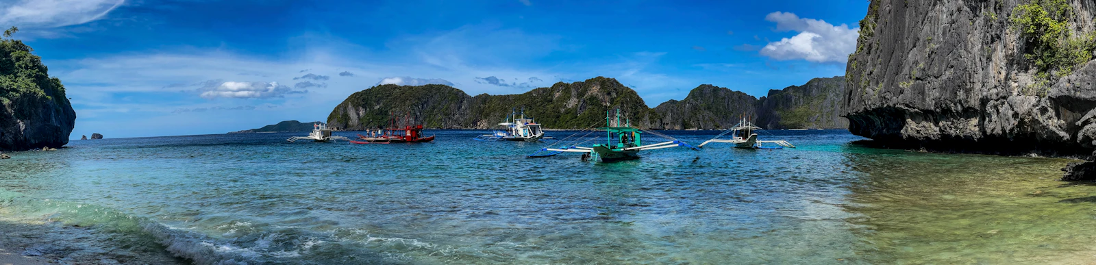 Aerial view of limestone karst islands and turquoise lagoons in El Nido, Palawan, Philippines