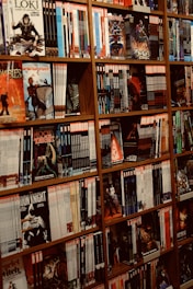 Shelves are filled with various comic books.