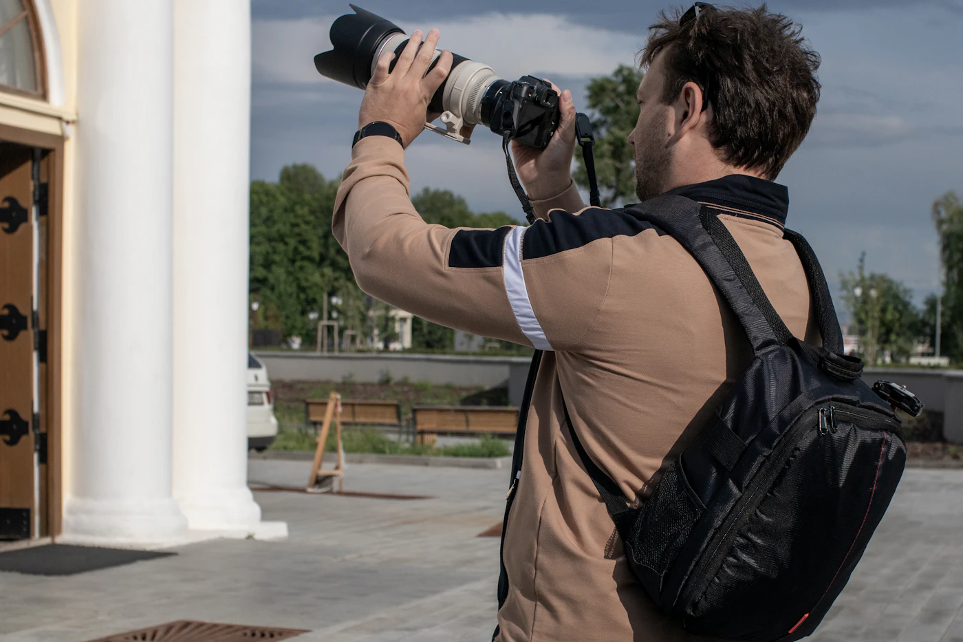 Professional photographer capturing an outdoor scene