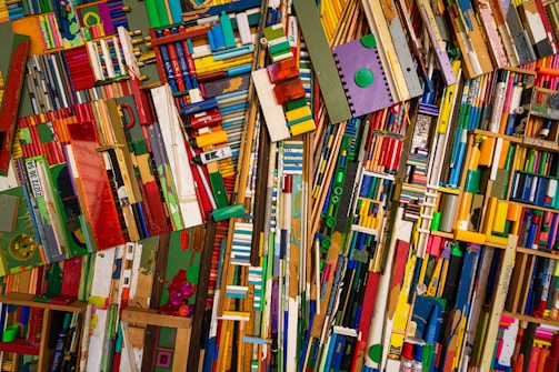 A colorful mosaic of stacked, various wooden pieces.