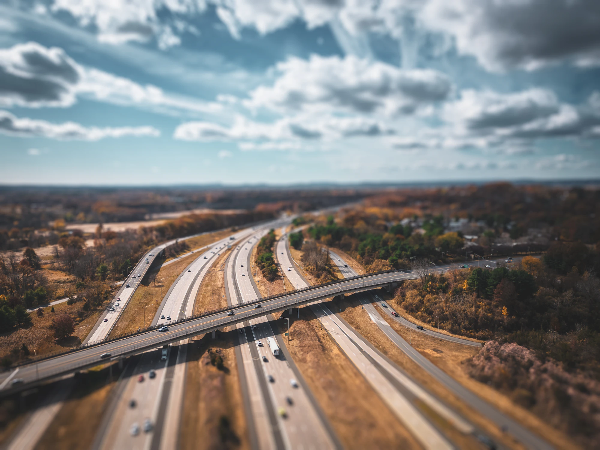 Aerial view of a curving highway interchange and overpasses