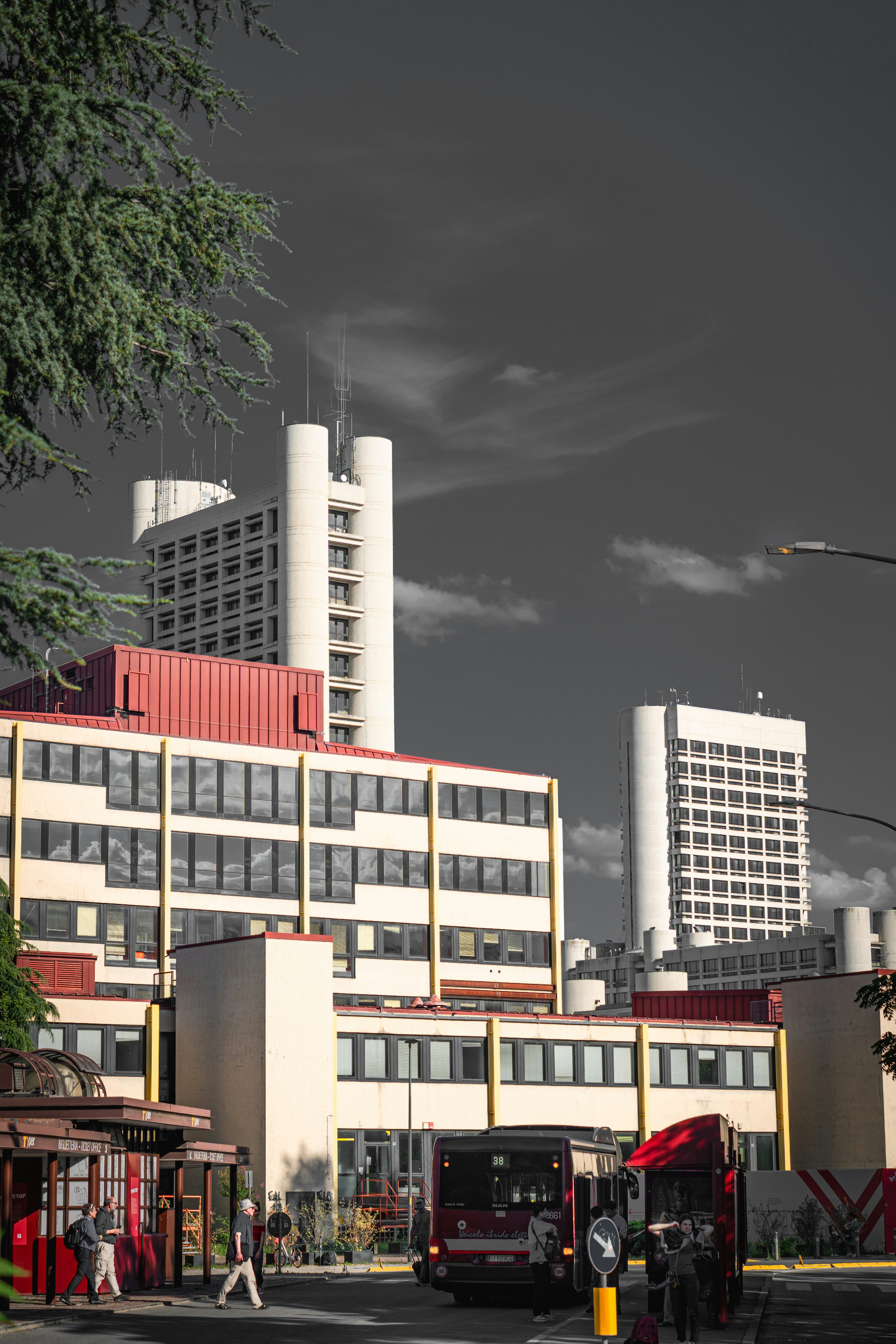 Buildings and a bus on a street in the city.