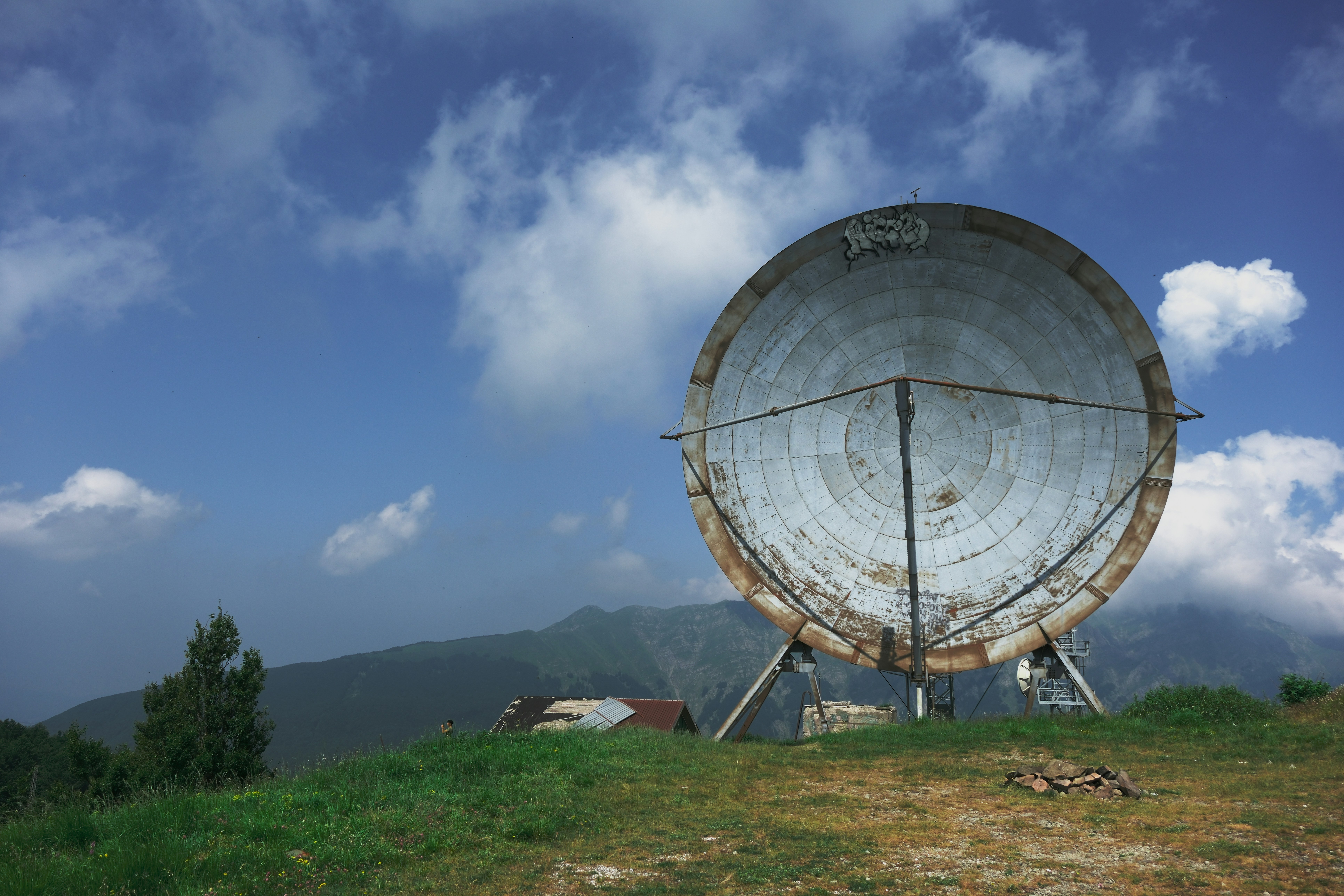 Large satellite dish under a blue sky