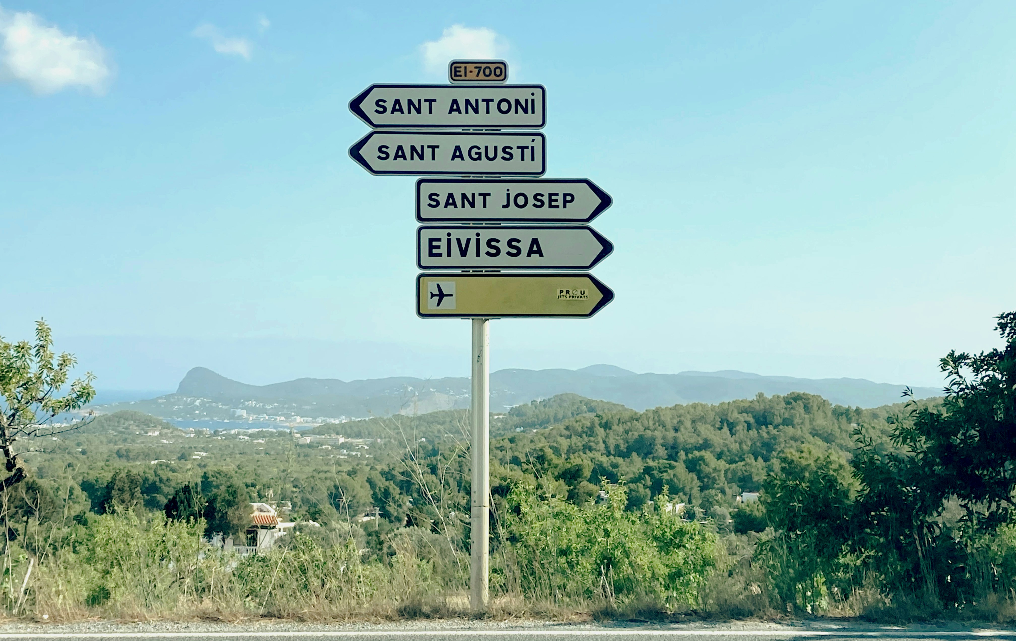 Road signs point to different places.