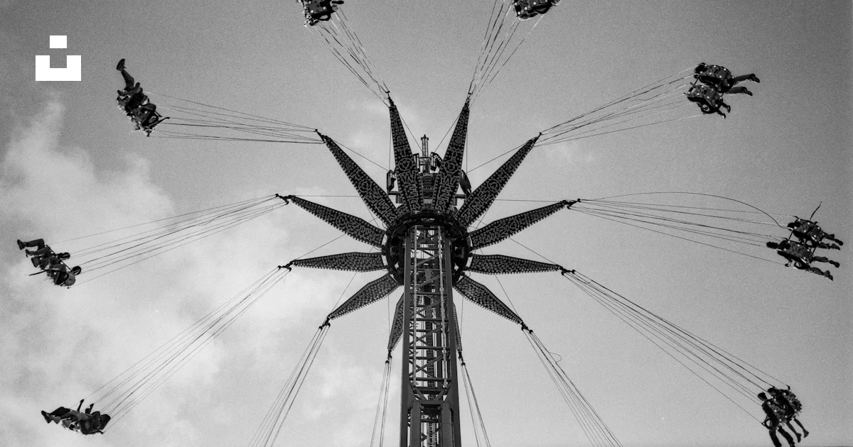 People ride a spinning swing ride in the sky. photo – Free France Image ...
