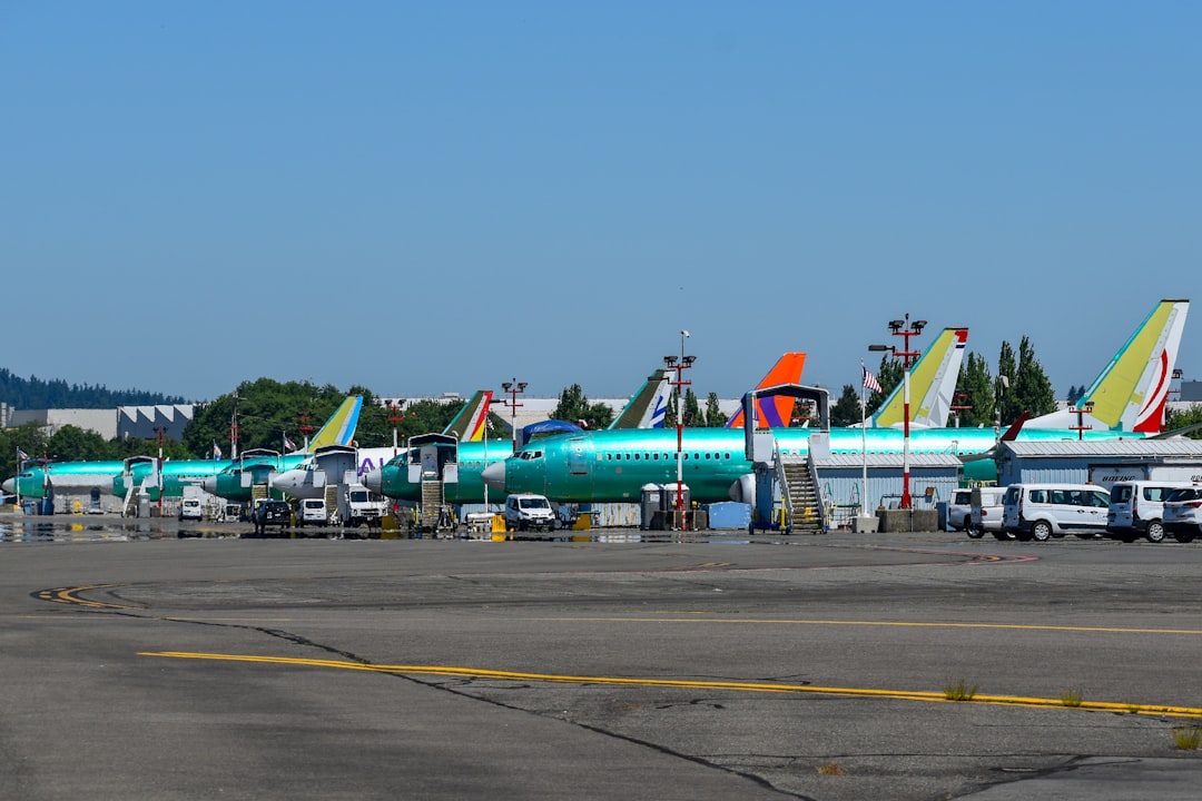 Airplanes are parked on the airport tarmac.