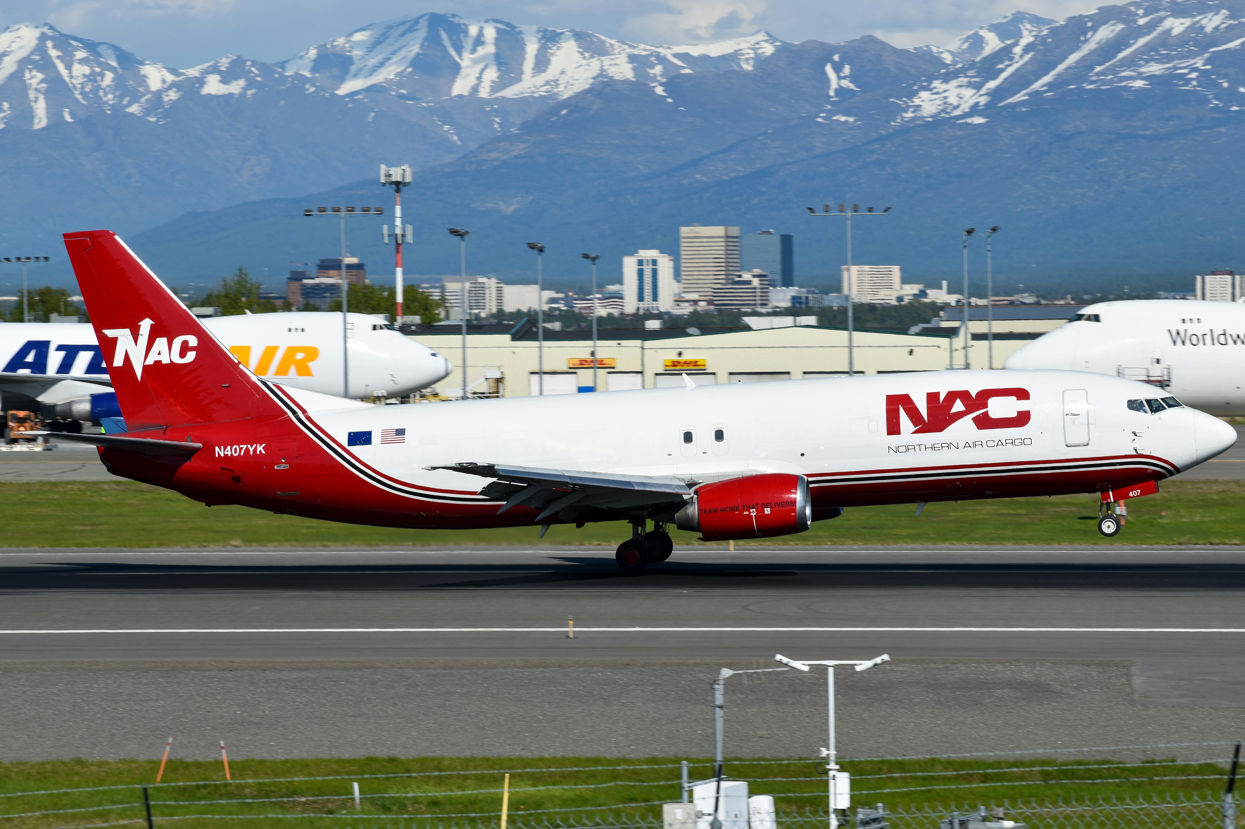 A nac cargo plane sits on a runway.