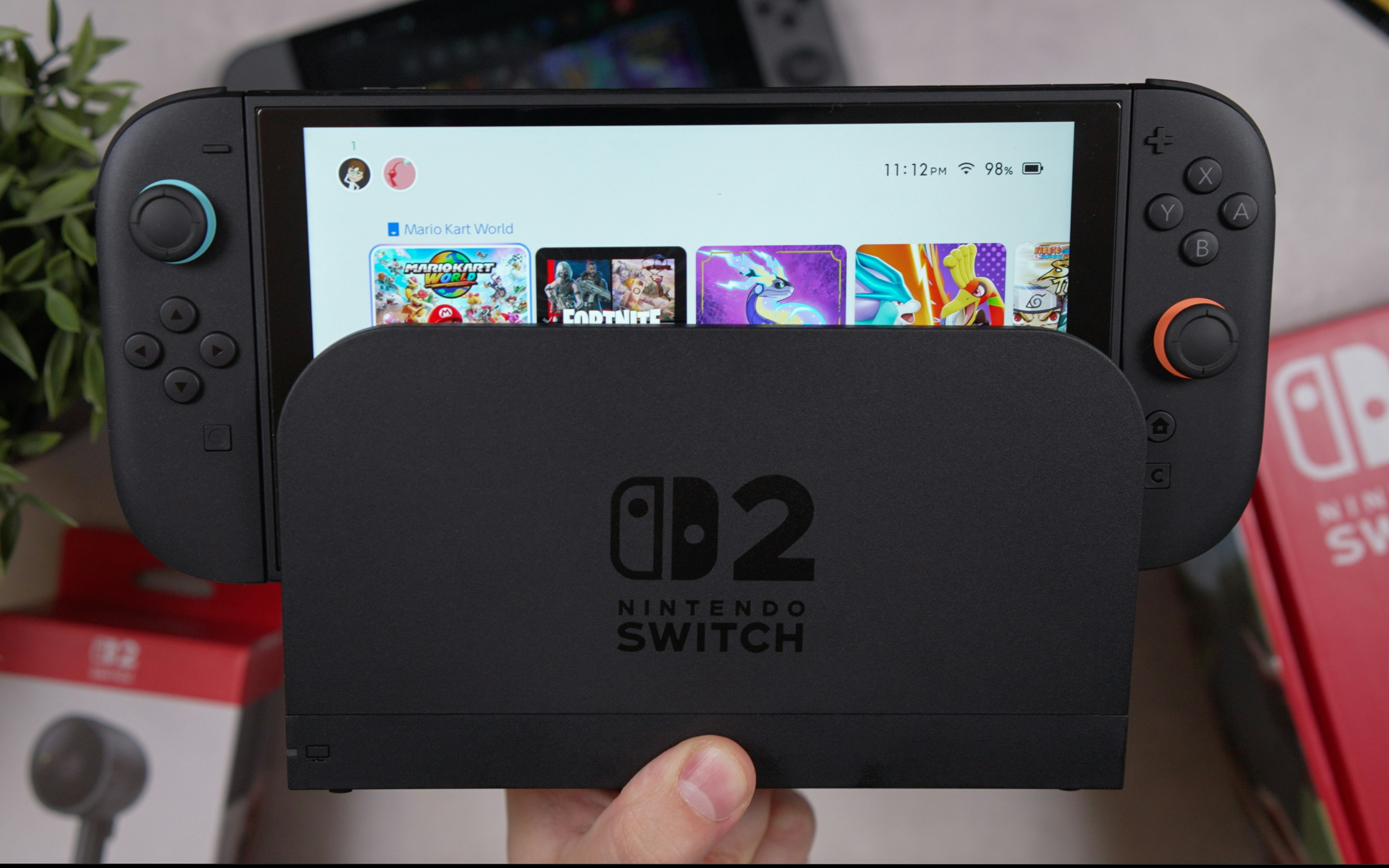 A nintendo switch is docked and on.