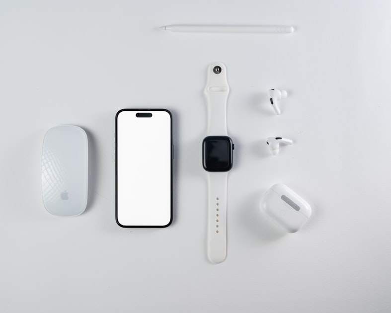 Apple devices and accessories arranged on a clean white background